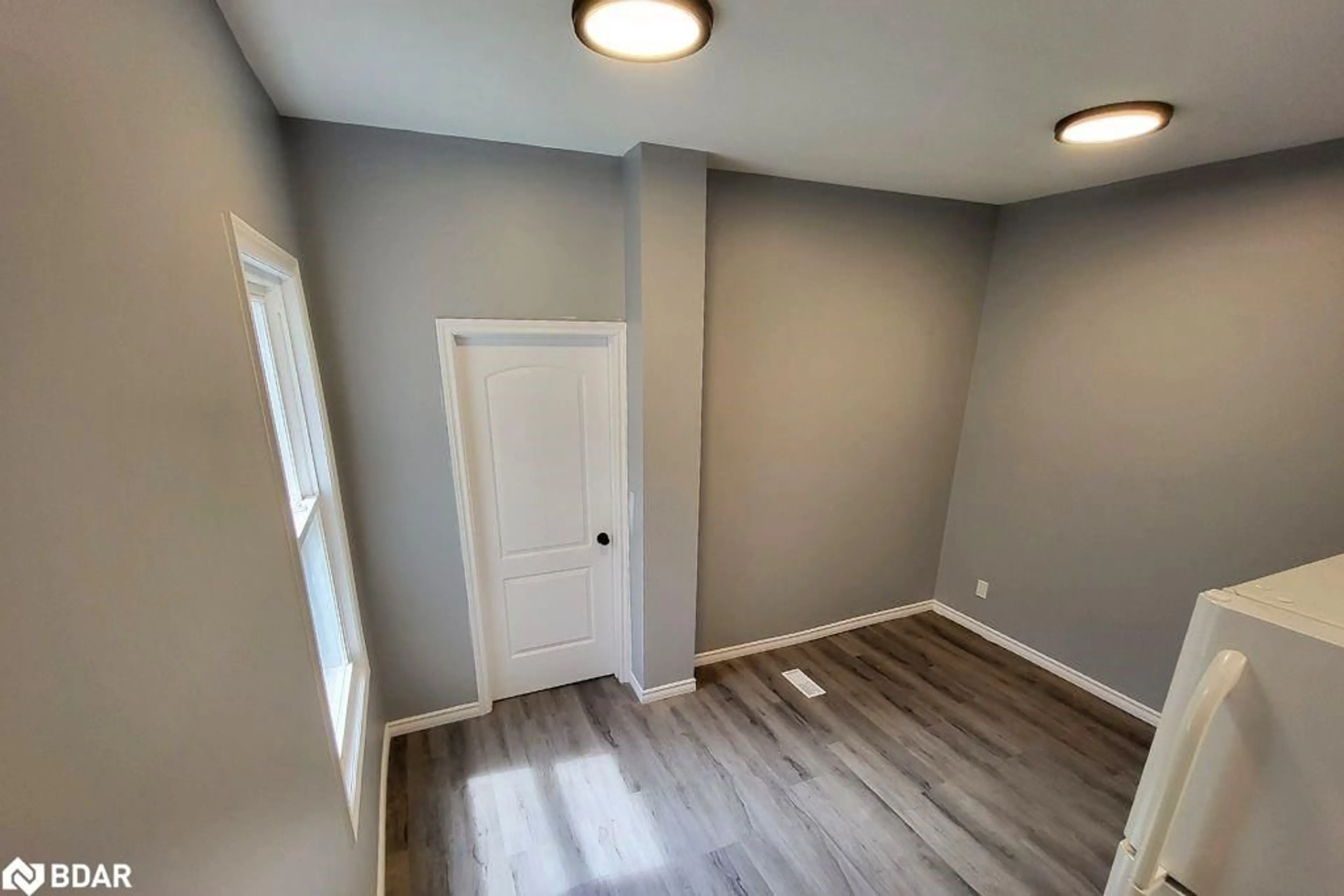 A pic of a room, wood floors for 102 Peel Street, Barrie Ontario L4M 3L4