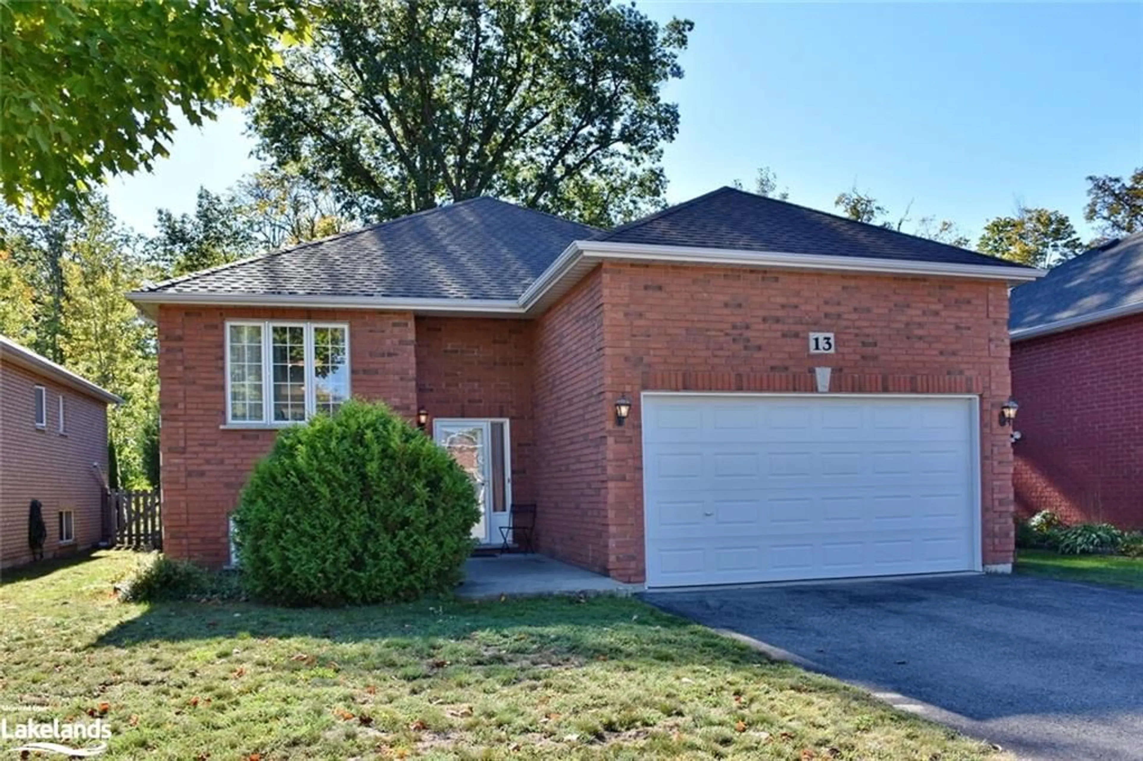 Home with brick exterior material for 13 Tona Trail, Wasaga Beach Ontario L9Z 0A5