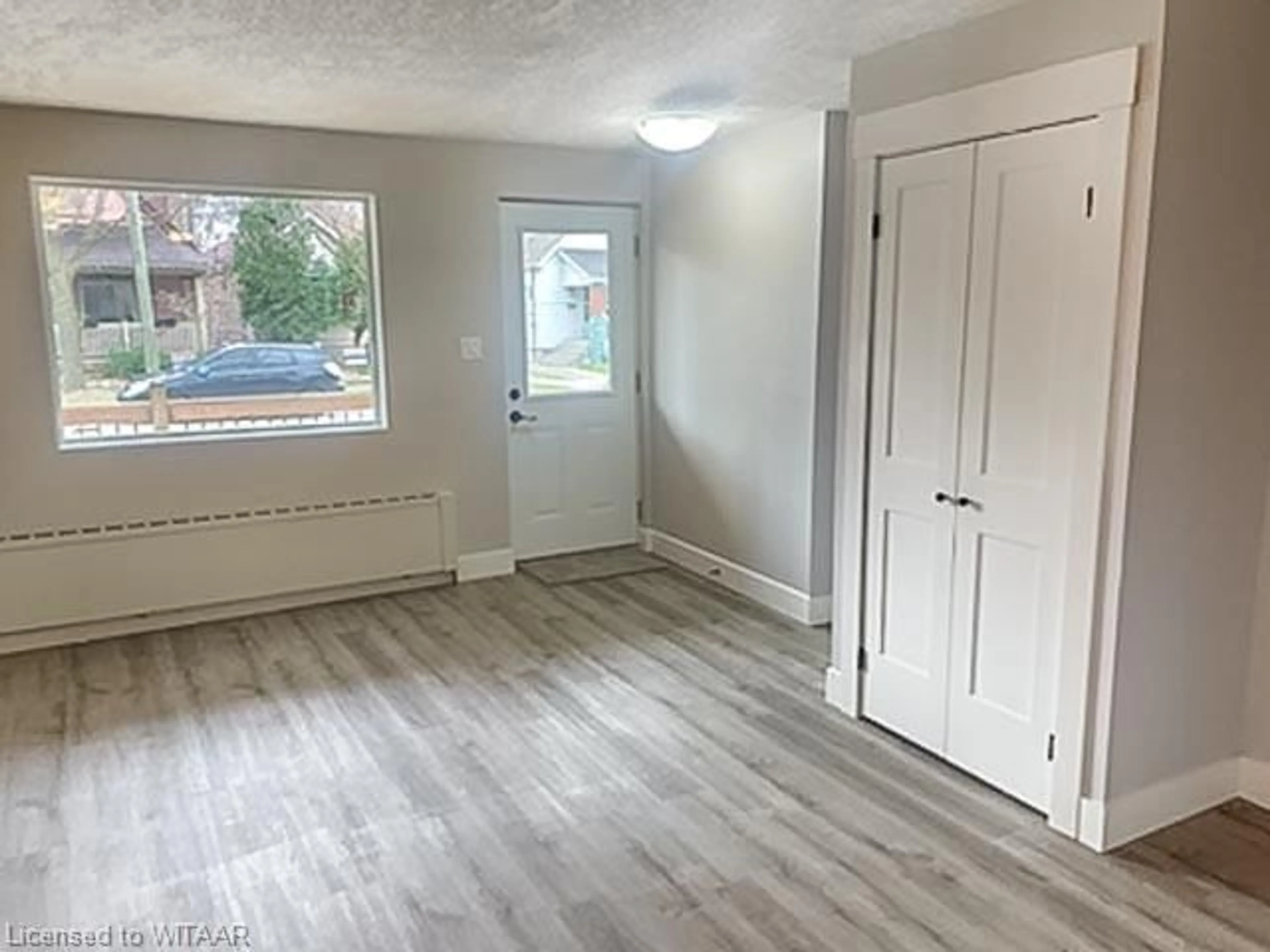 A pic of a room, wood floors for 12 Victor St, London Ontario N6C 1B7