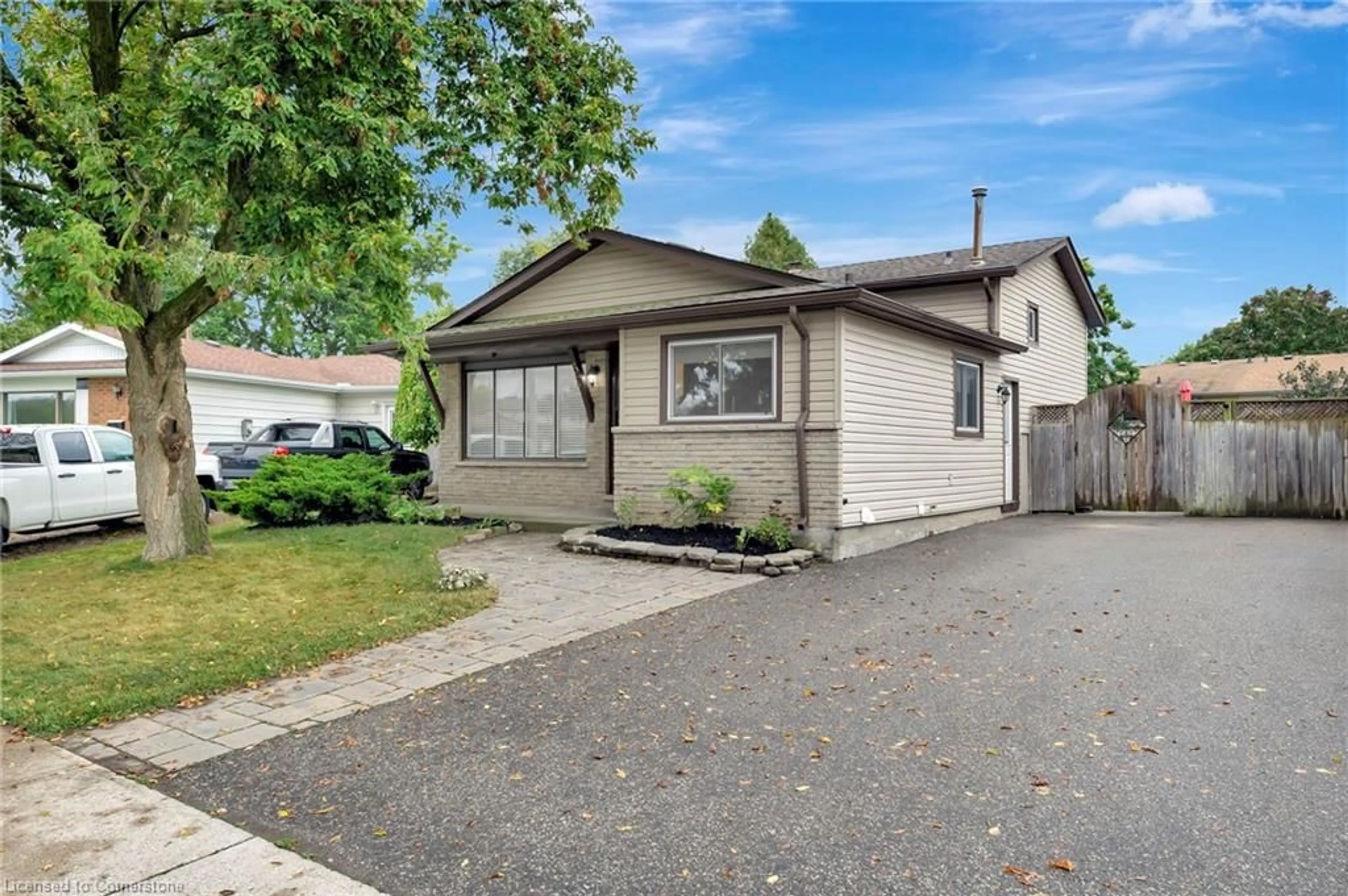 A pic from exterior of the house or condo, the fenced backyard for 37 Broken Oak Cres, Kitchener Ontario N2N 1N8