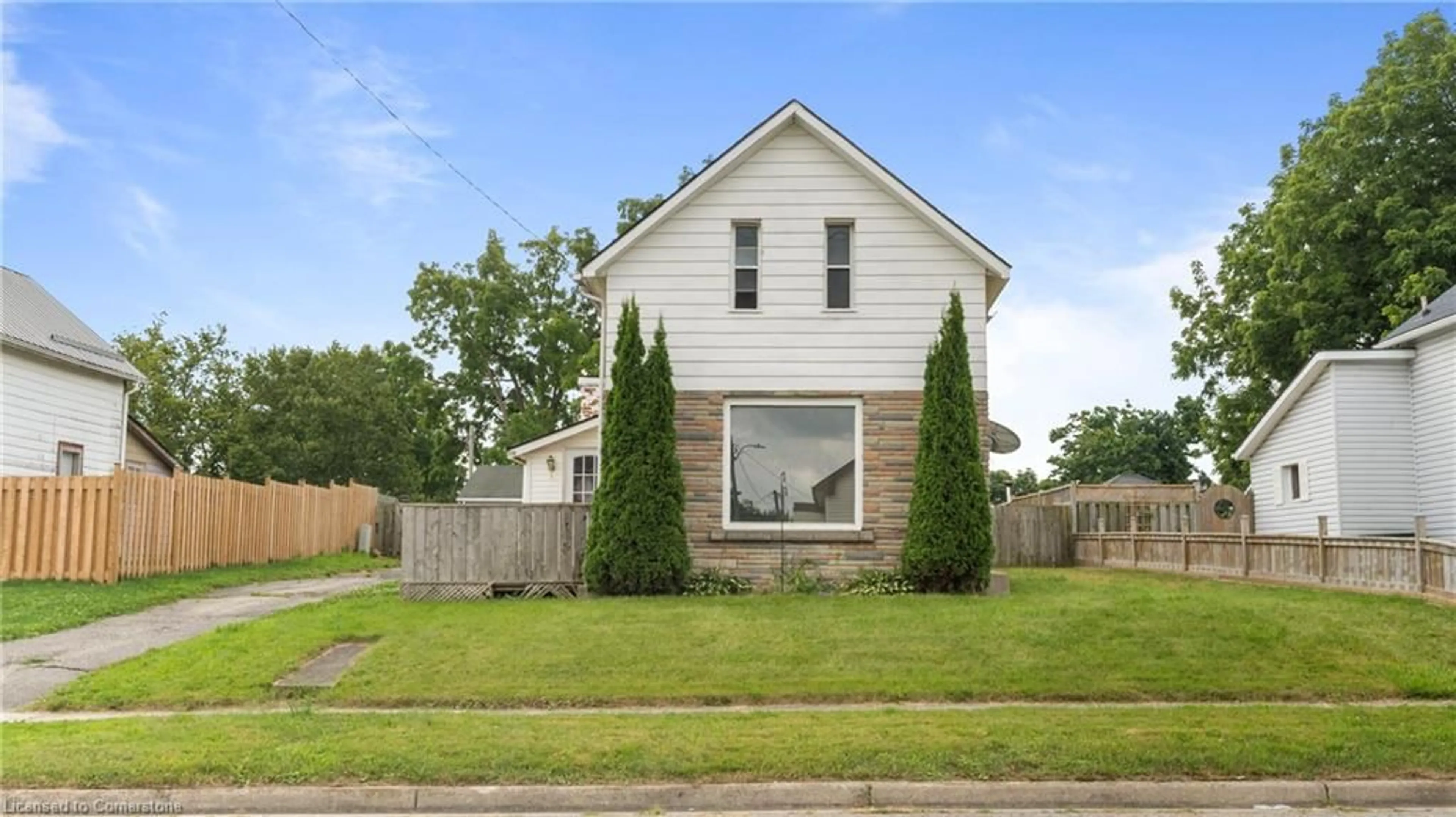 Frontside or backside of a home, the fenced backyard for 212 Grove St, Simcoe Ontario N3Y 1K6