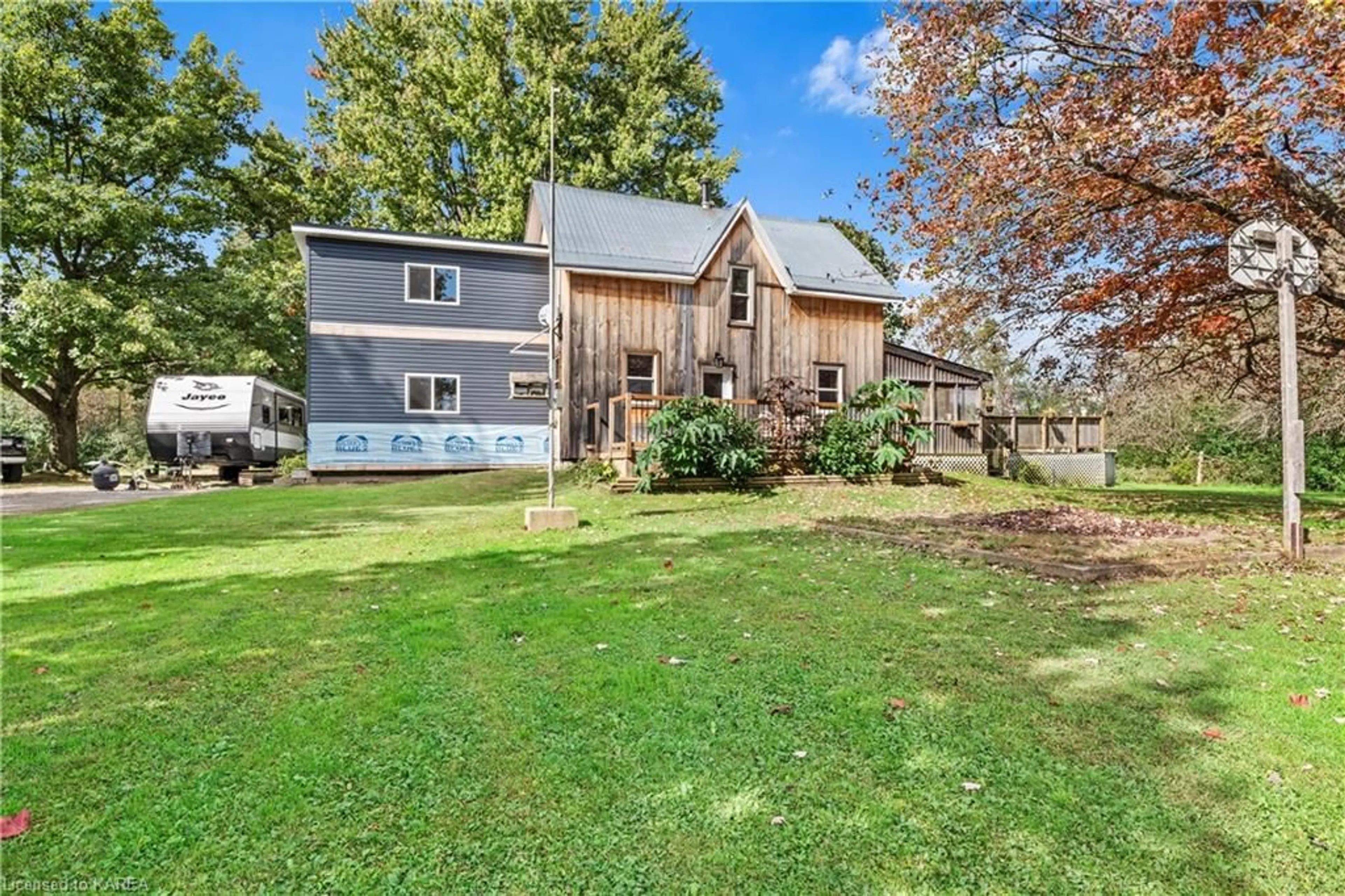 Frontside or backside of a home, the fenced backyard for 108 Lake Street, Mallorytown Ontario K0E 1R0