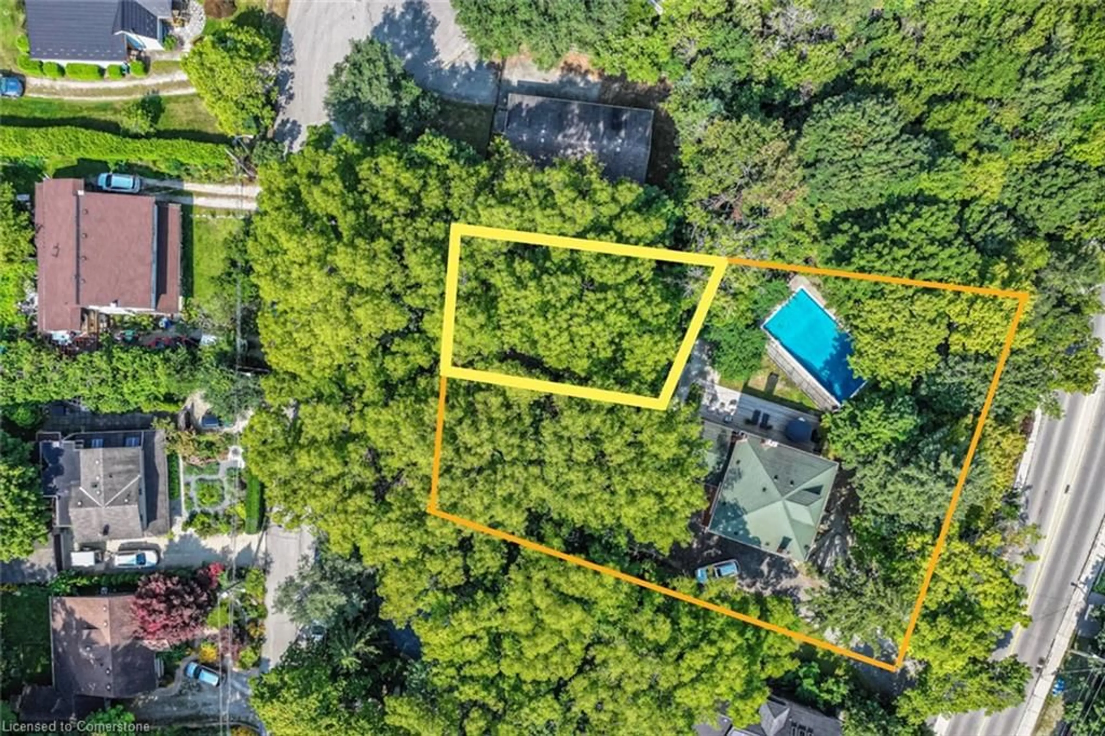 A pic from exterior of the house or condo, the fenced backyard for 17 Queen St, Hamilton Ontario L9H 2V3