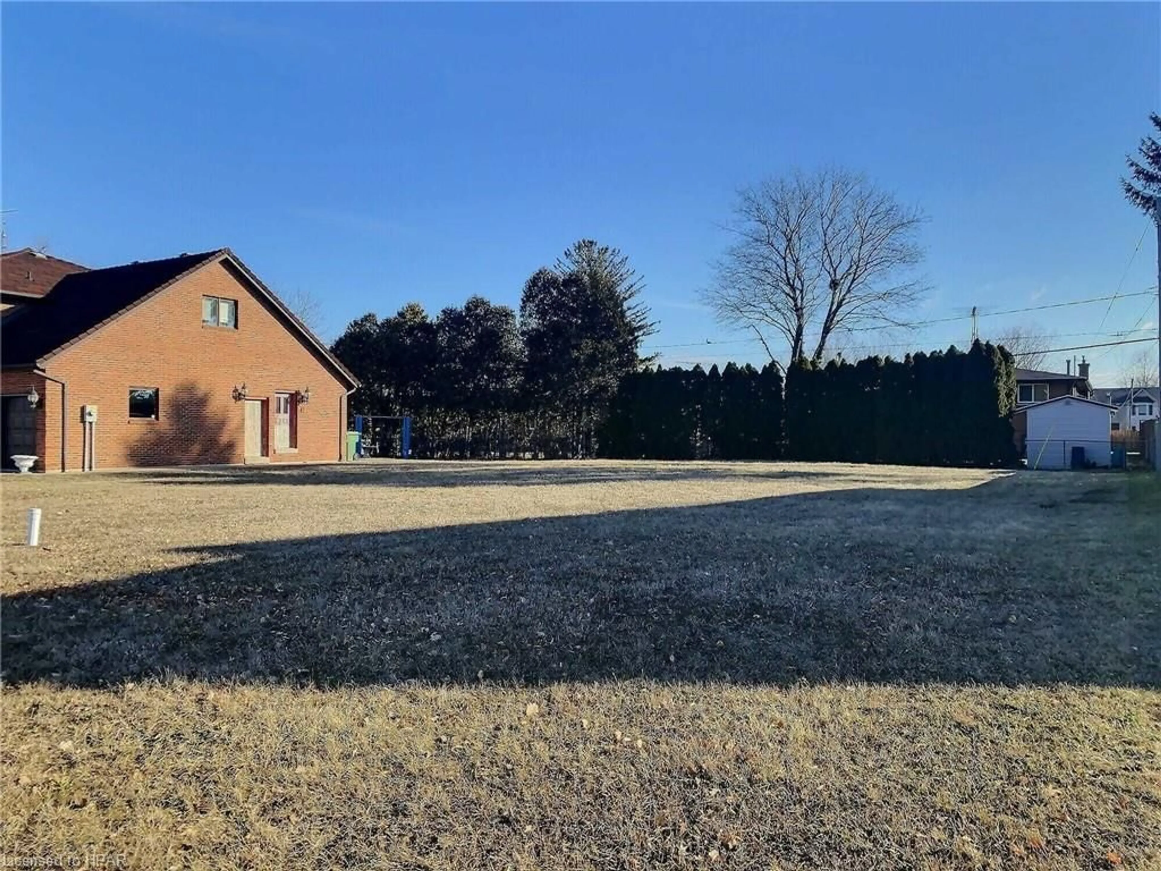 Frontside or backside of a home, the fenced backyard for 5758 Bagley Ave, LaSalle Ontario N9H 1P1