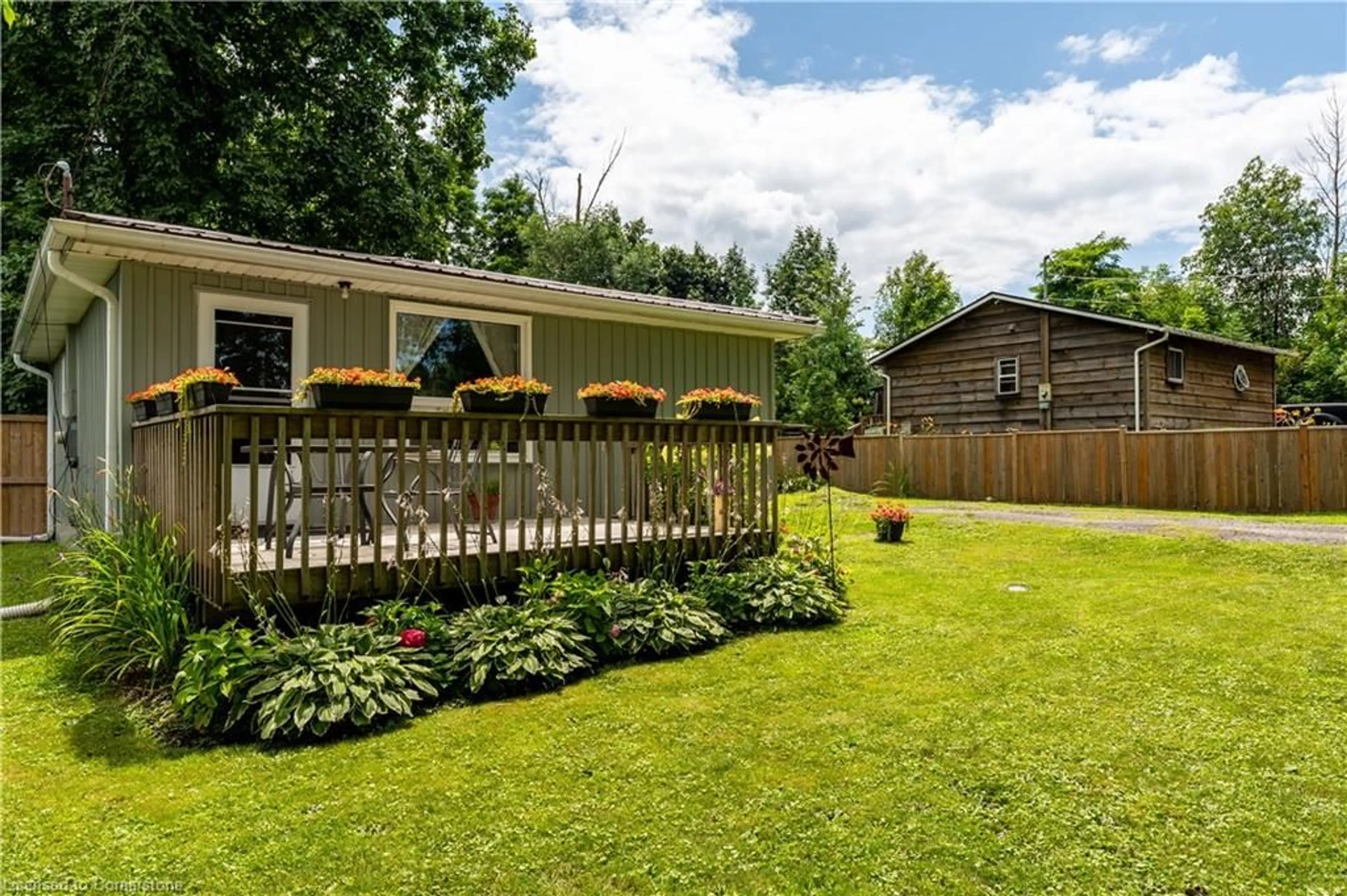 Frontside or backside of a home, the fenced backyard for 4 Nanticoke Valley Rd, Nanticoke Ontario N0A 1L0