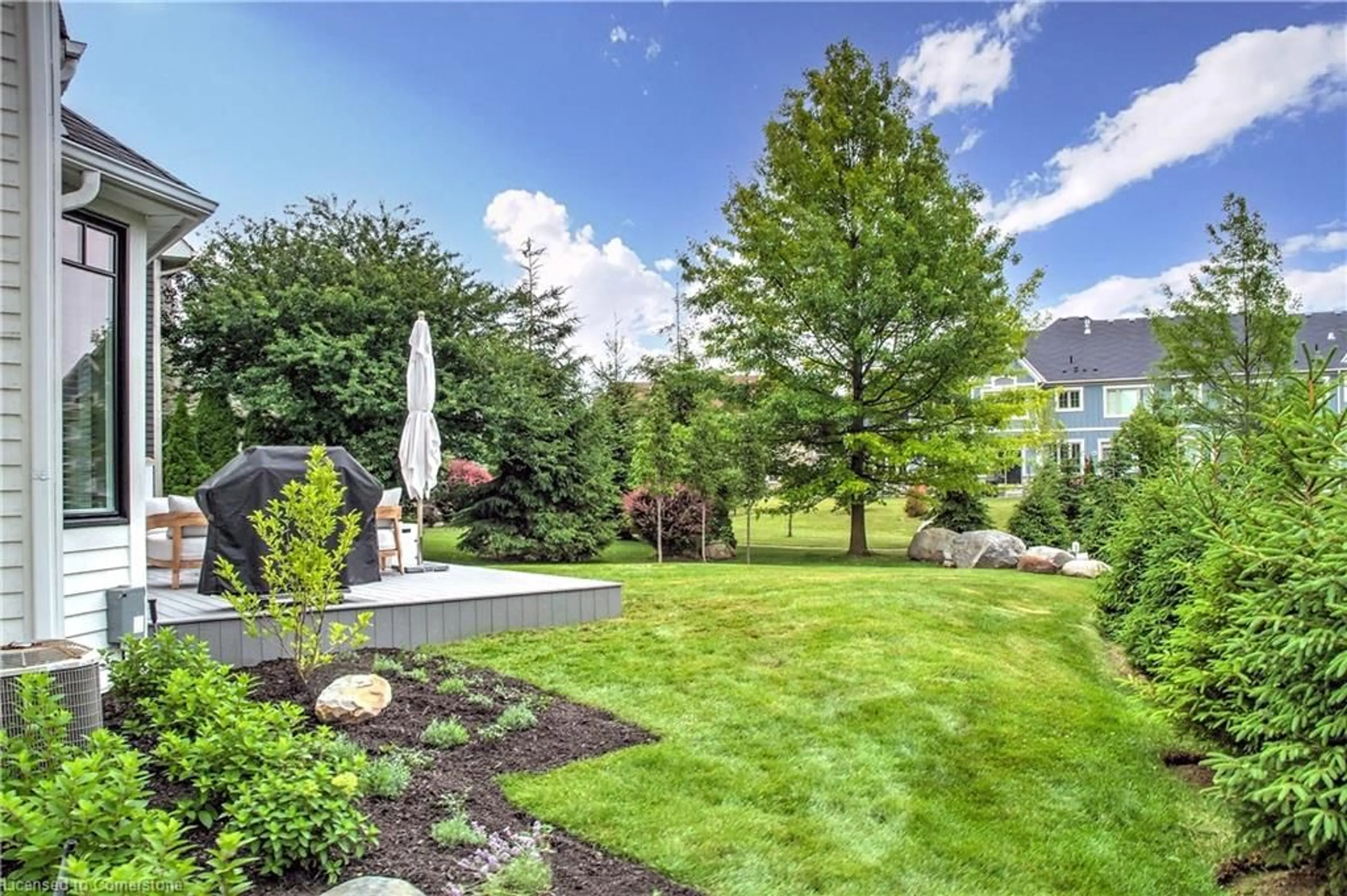 Patio, the fenced backyard for 141 Snowbridge Way, The Blue Mountains Ontario L9Y 0V1