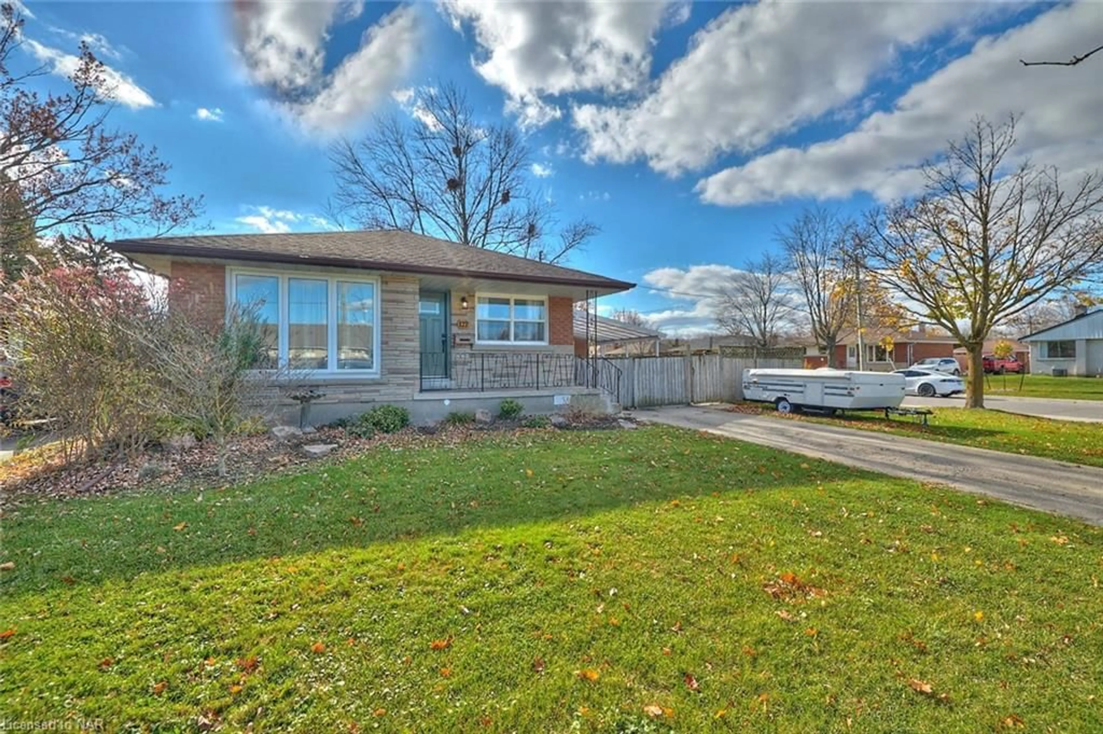 A pic from exterior of the house or condo, the fenced backyard for 127 Windsor St, Welland Ontario L3C 5K5