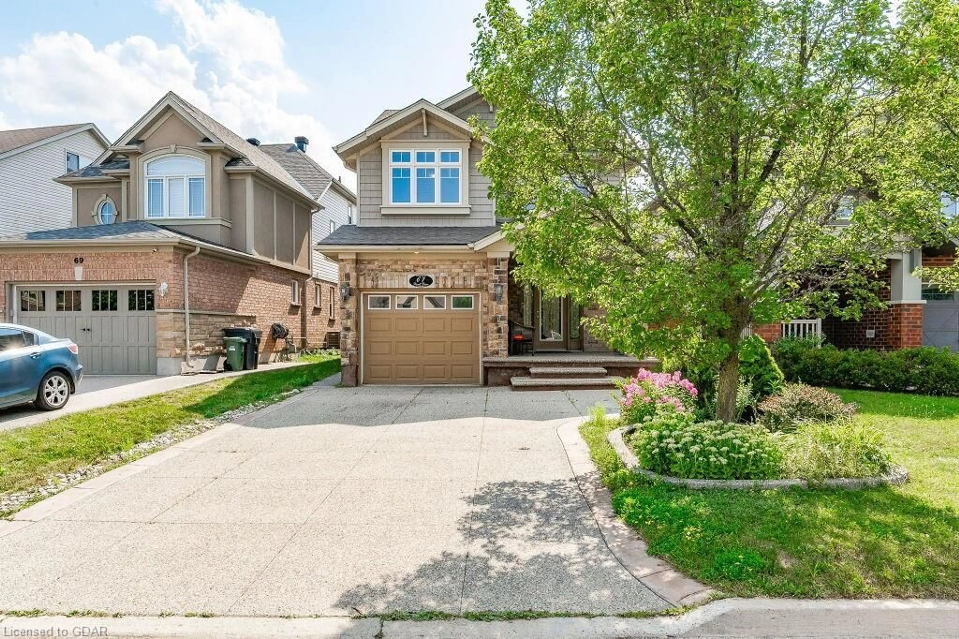 Frontside or backside of a home, the street view for 67 Revell Dr, Guelph Ontario N1G 0B1