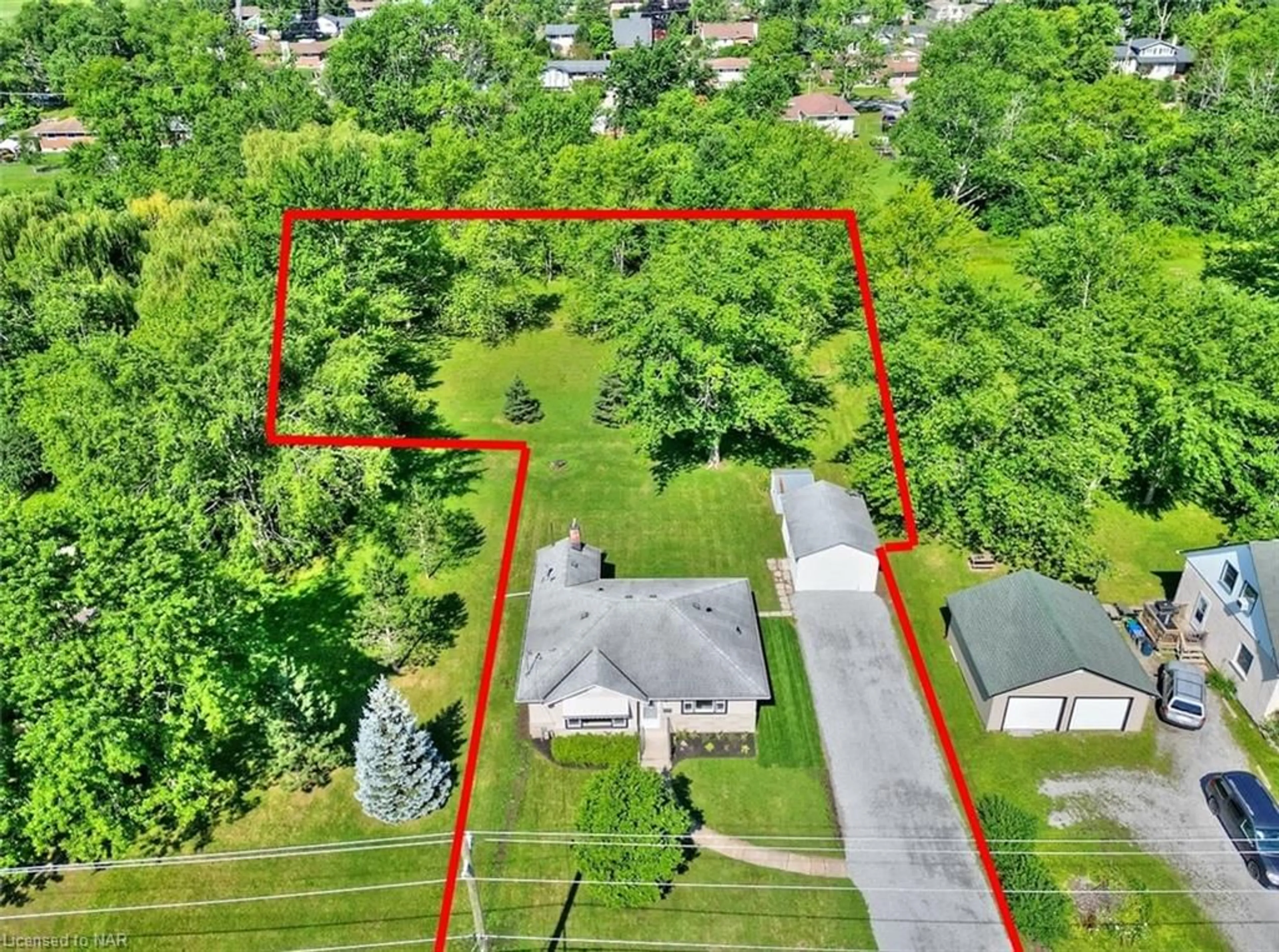 Frontside or backside of a home, the fenced backyard for 855 Crescent Rd, Fort Erie Ontario L2A 4R5