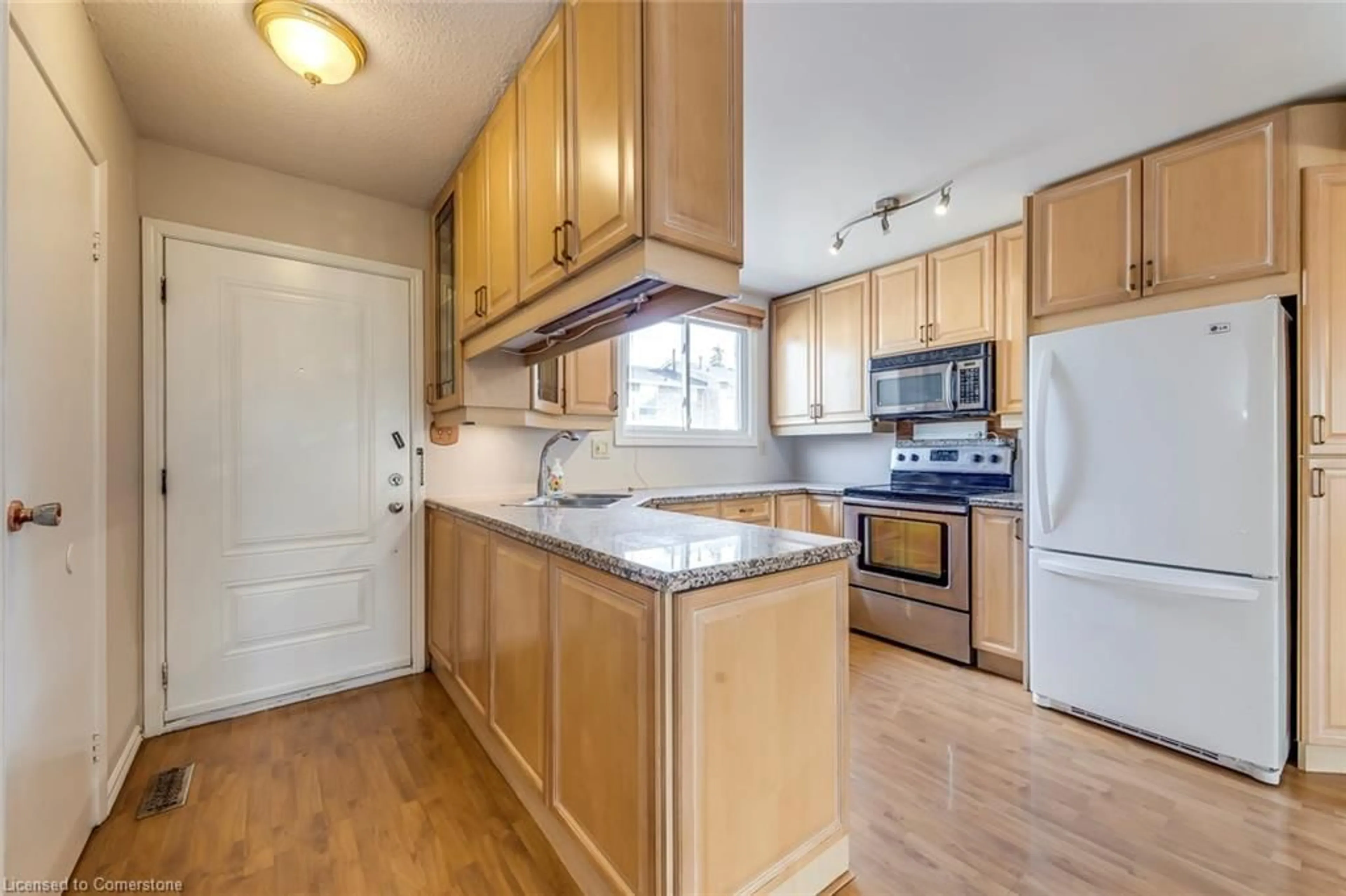 Standard kitchen, wood floors, cottage for 120 Quigley Rd #69, Hamilton Ontario L8K 6L4