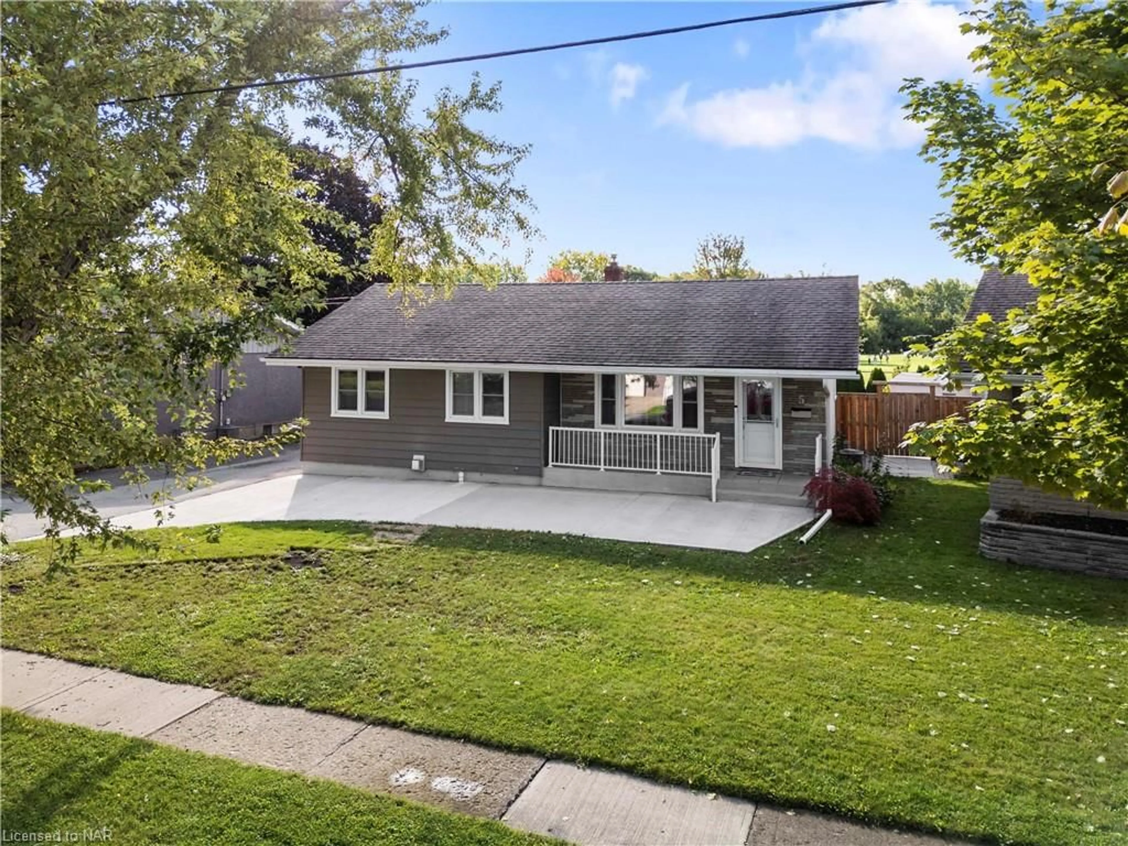 Frontside or backside of a home, the fenced backyard for 5 Draper Dr, St. Catharines Ontario L2N 2Y3