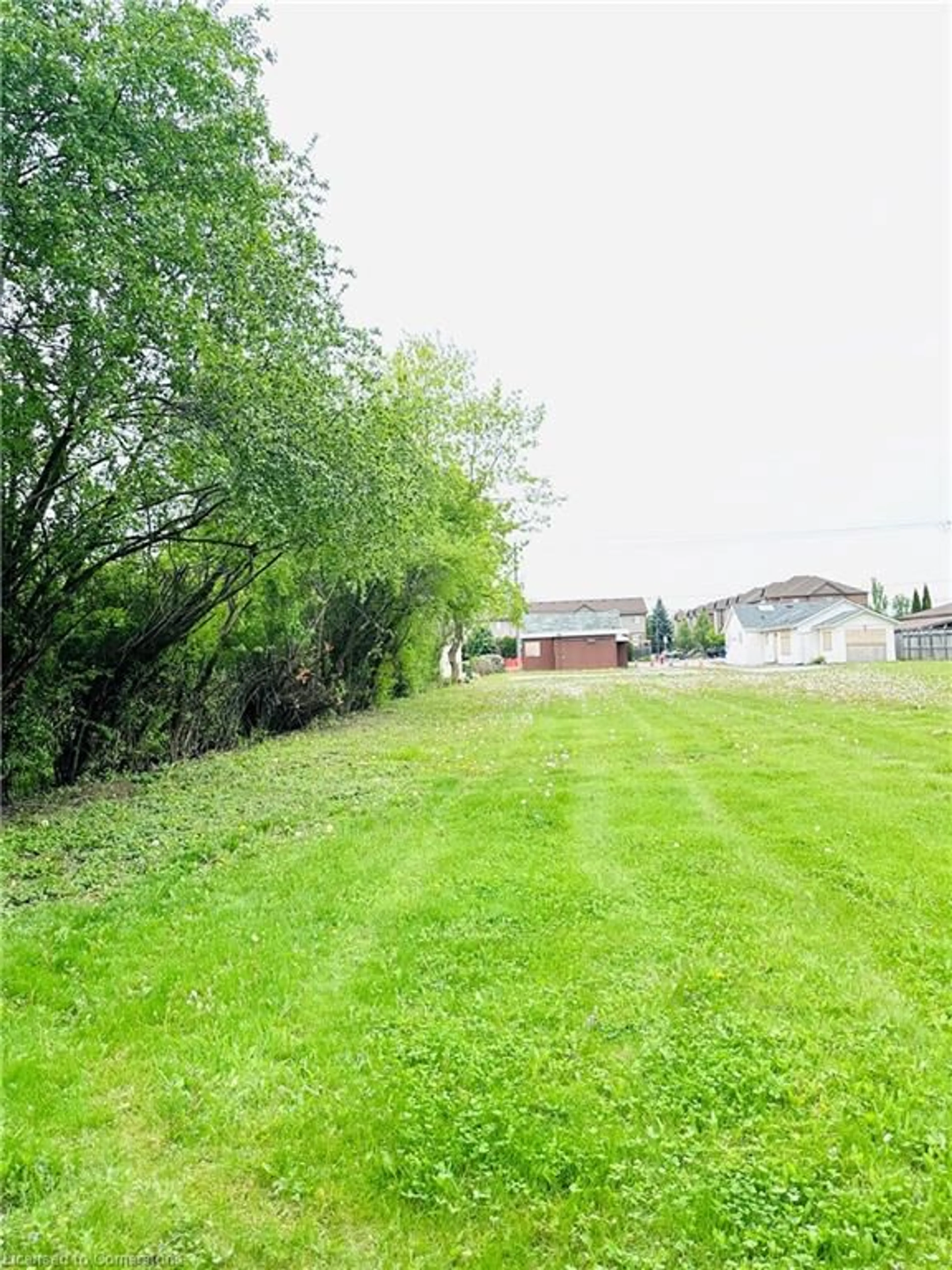 Frontside or backside of a home, the fenced backyard for 146 Green Rd, Stoney Creek Ontario L8G 3X1