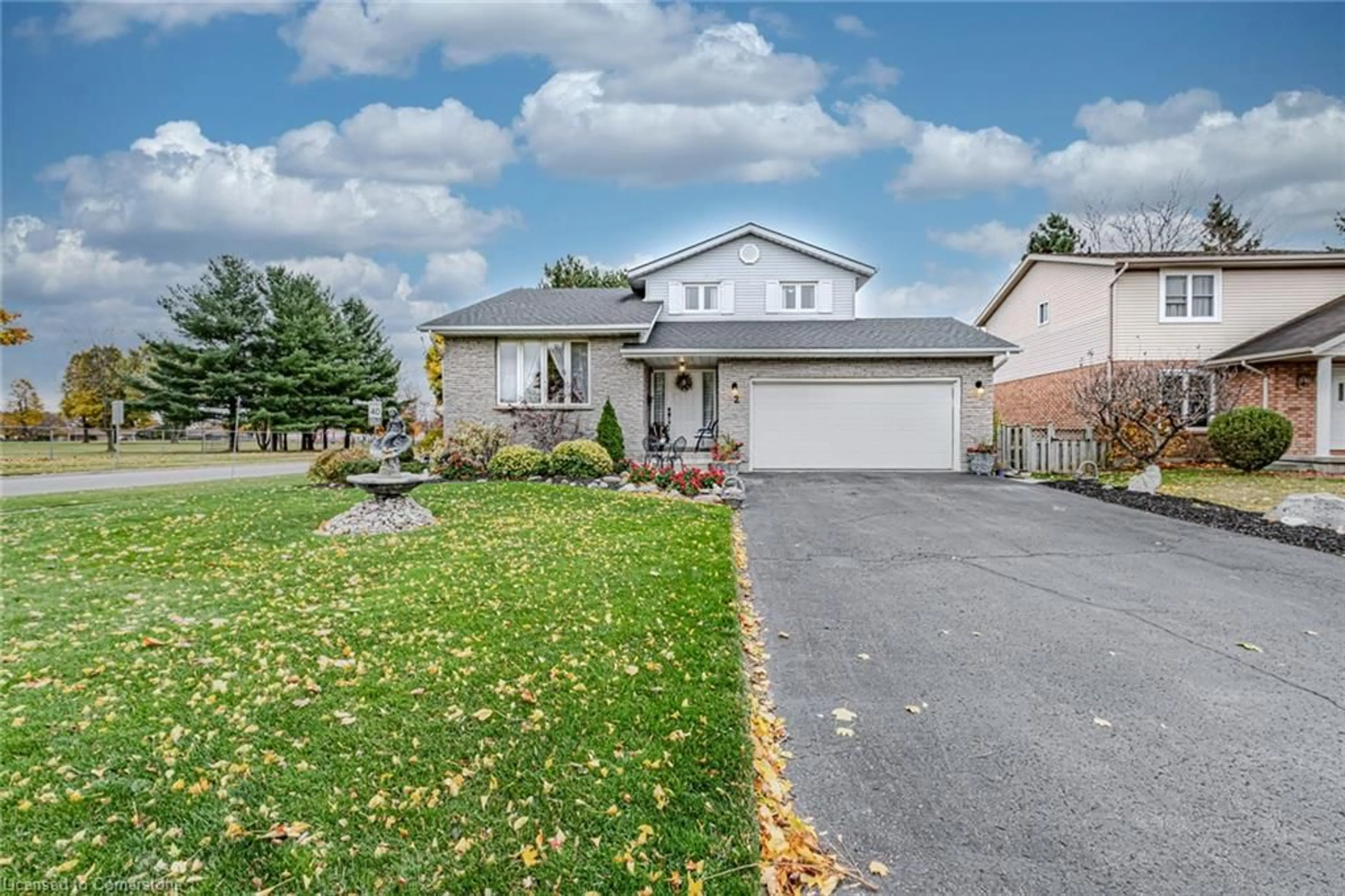 Frontside or backside of a home, the fenced backyard for 2 Angle St, Simcoe Ontario N3Y 5G6