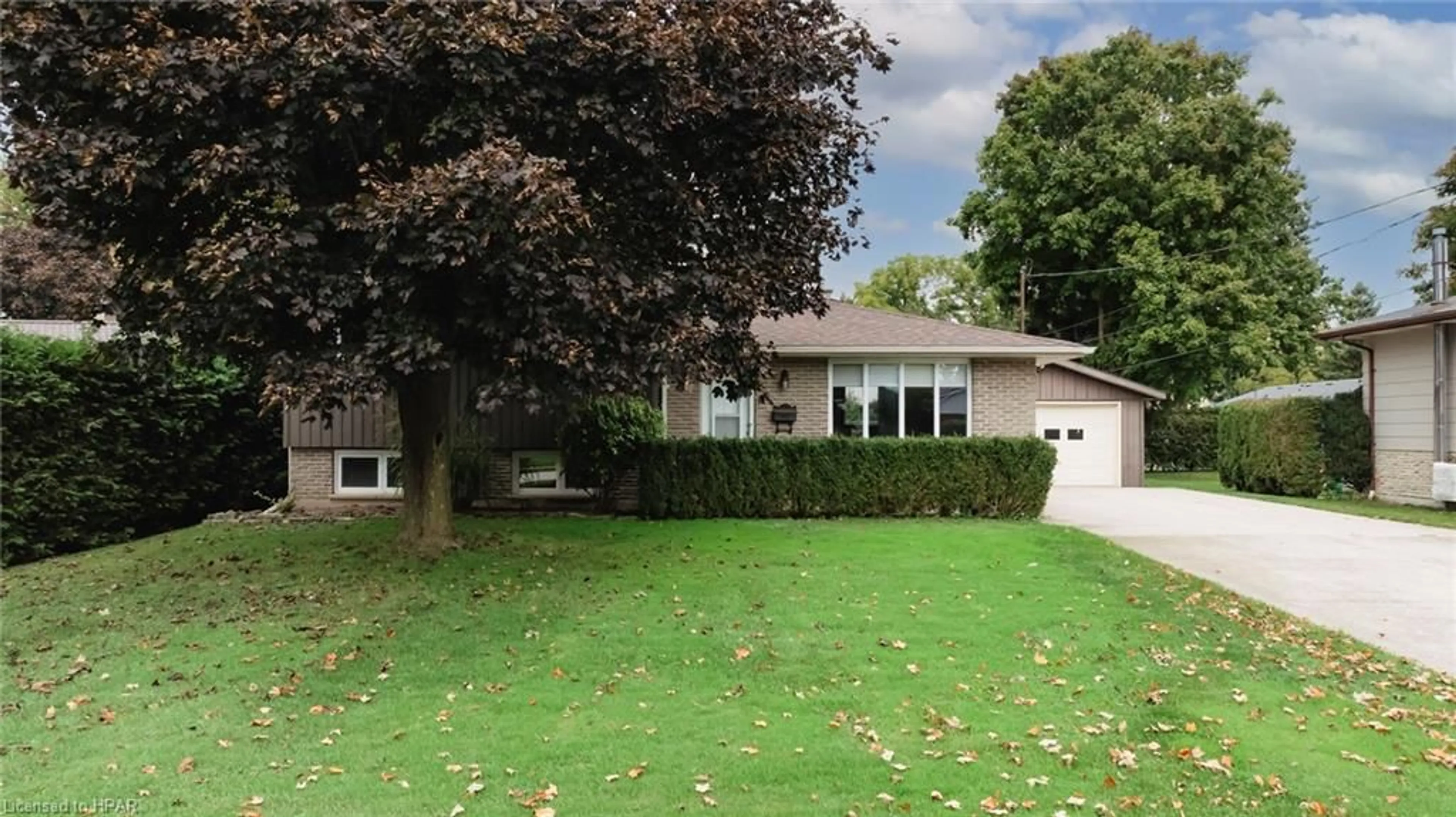 Frontside or backside of a home, the fenced backyard for 110 Kent Ave, Lucan Ontario N0M 2J0