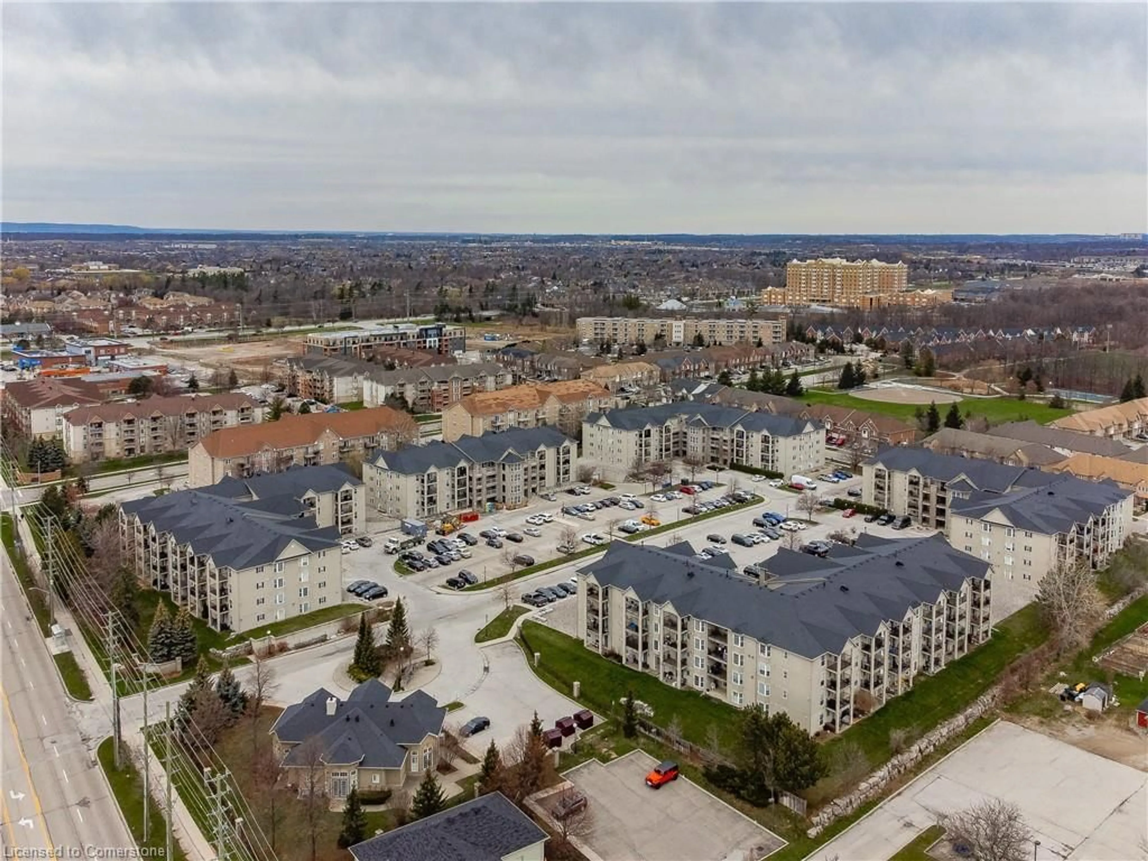 A pic from exterior of the house or condo, the view of city buildings for 1441 Walker's Line #301, Burlington Ontario L7M 4P2