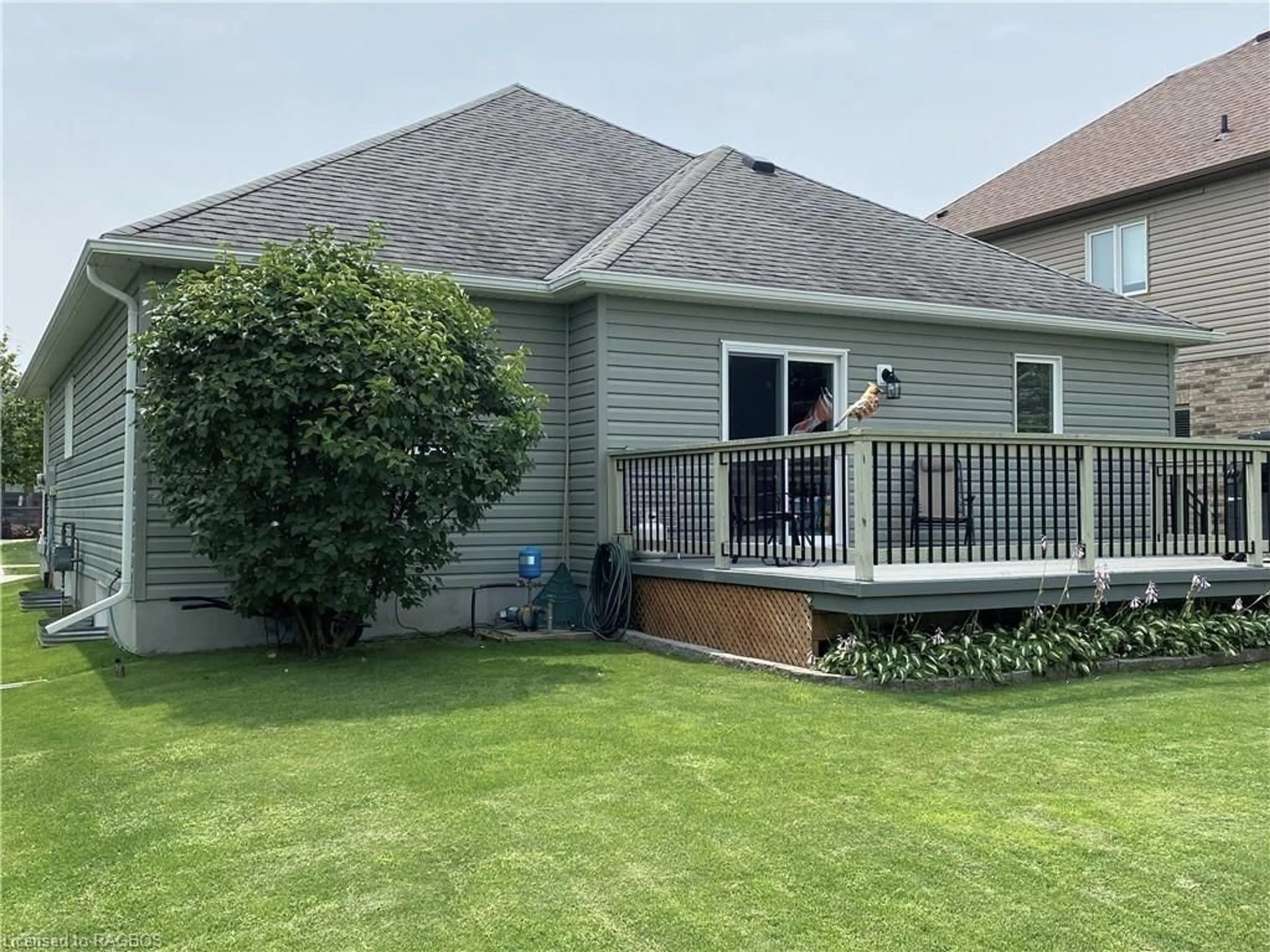 Frontside or backside of a home, the fenced backyard for 873 Sumpton St, Port Elgin Ontario N0H 2C2