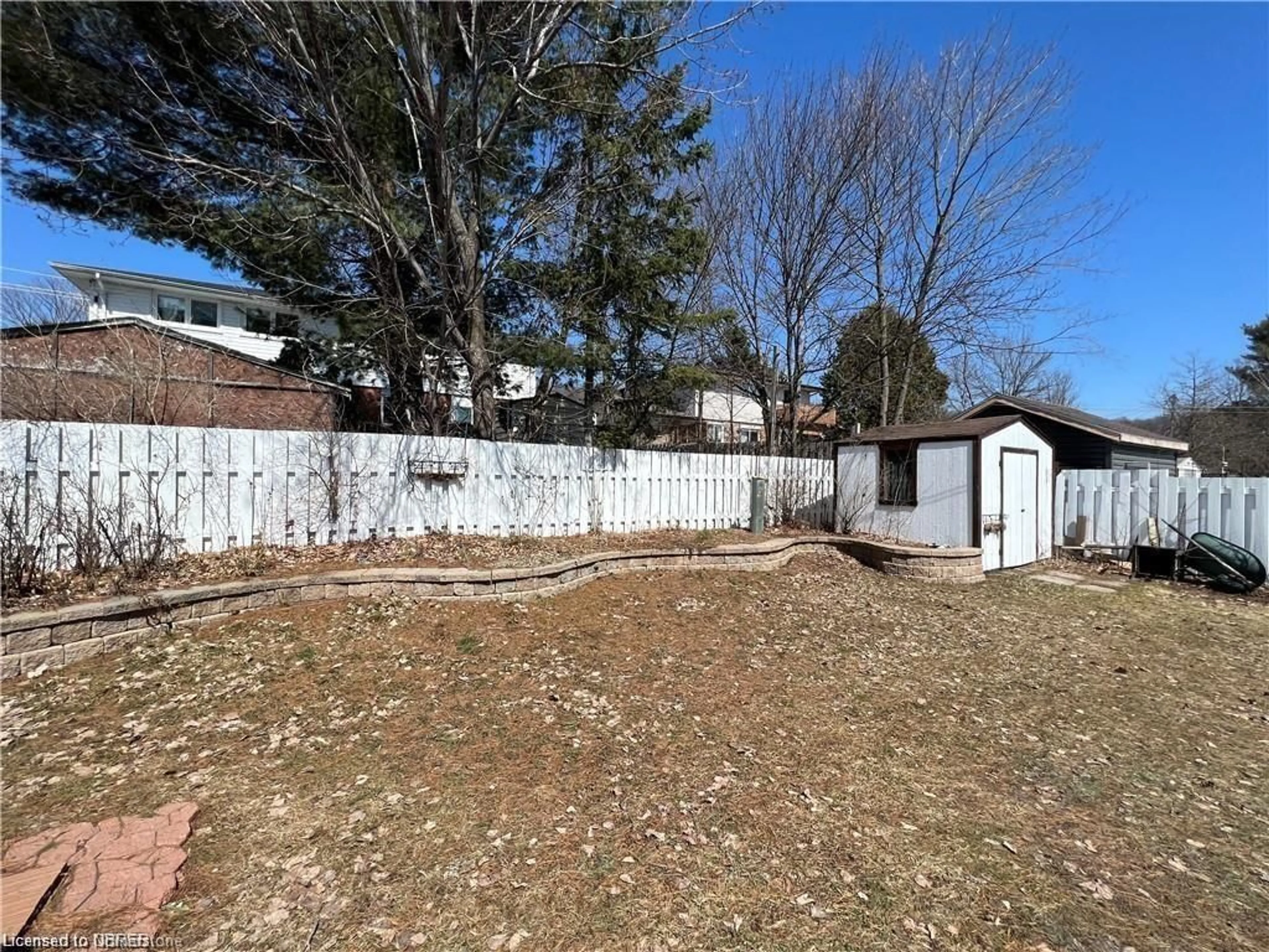 Frontside or backside of a home, the fenced backyard for 88 Beverly Rd, North Bay Ontario P1B 7P8