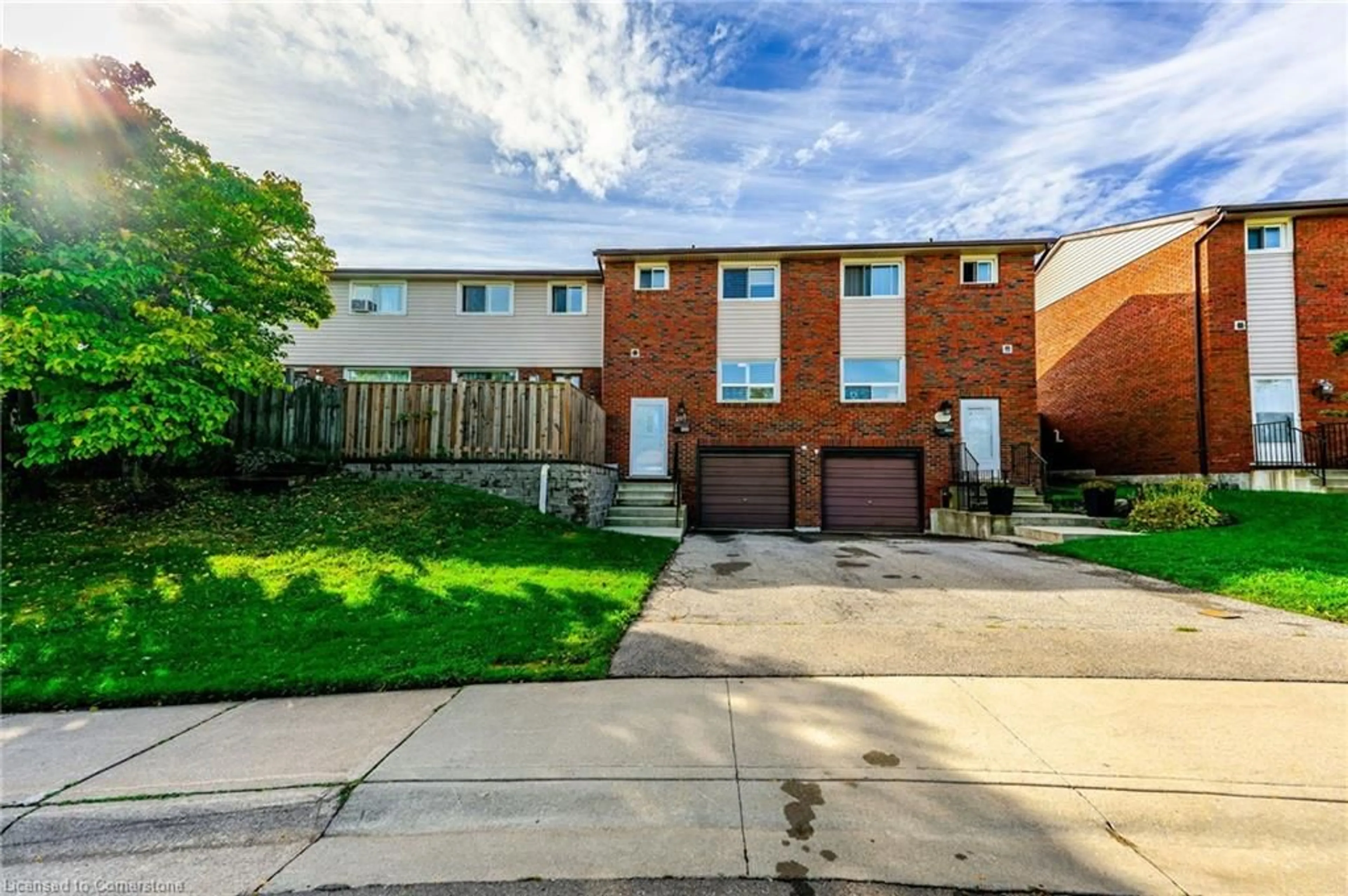 A pic from exterior of the house or condo, the fenced backyard for 202 Lavina Cres #10, Hamilton Ontario L9C 6R8