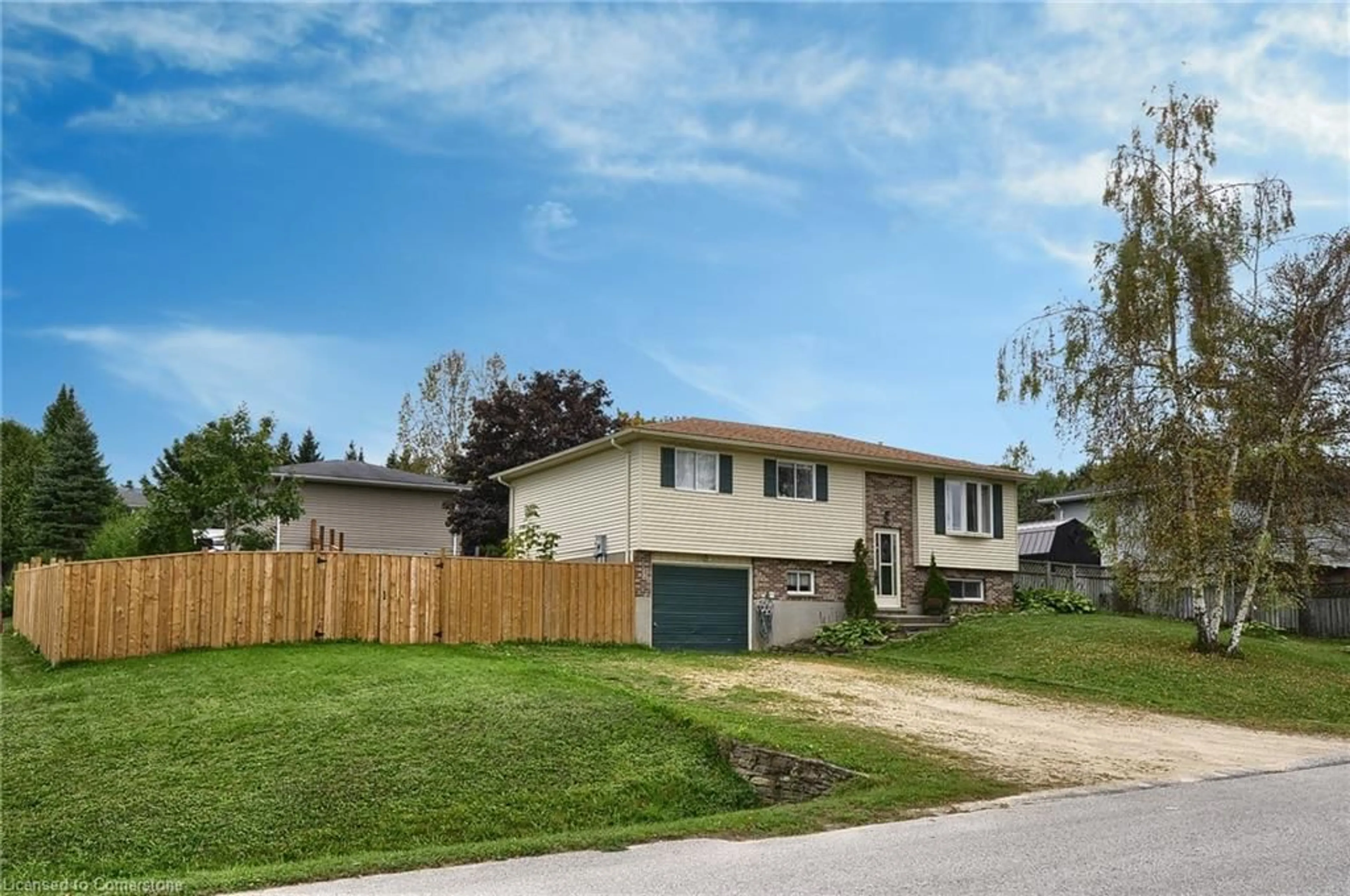 Frontside or backside of a home, the fenced backyard for 2 Brackenbury St, Markdale Ontario N0C 1H0