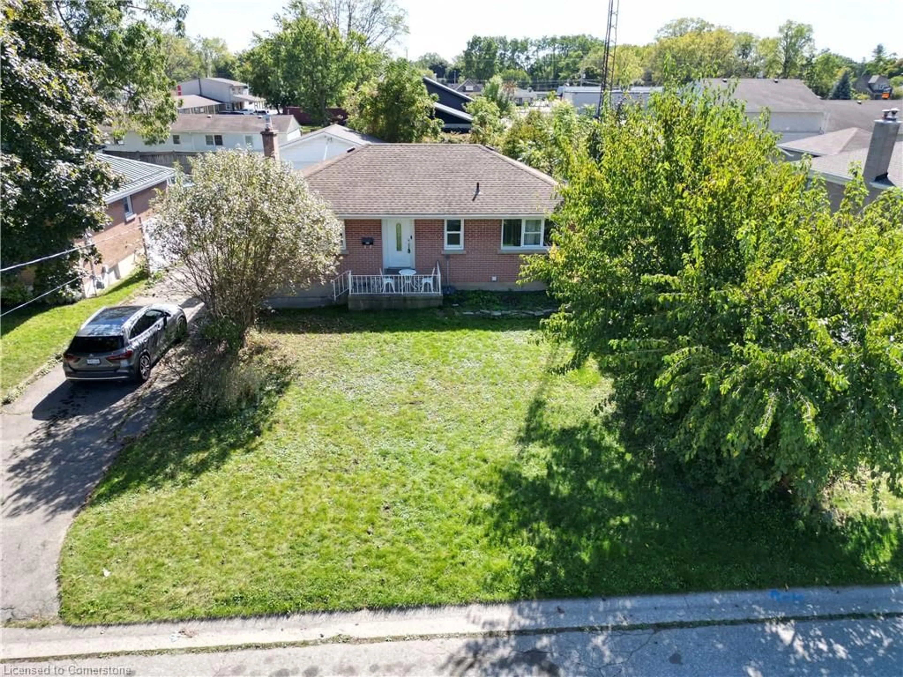 Frontside or backside of a home, the fenced backyard for 11 Woodman Dr, Brantford Ontario N3S 4K2