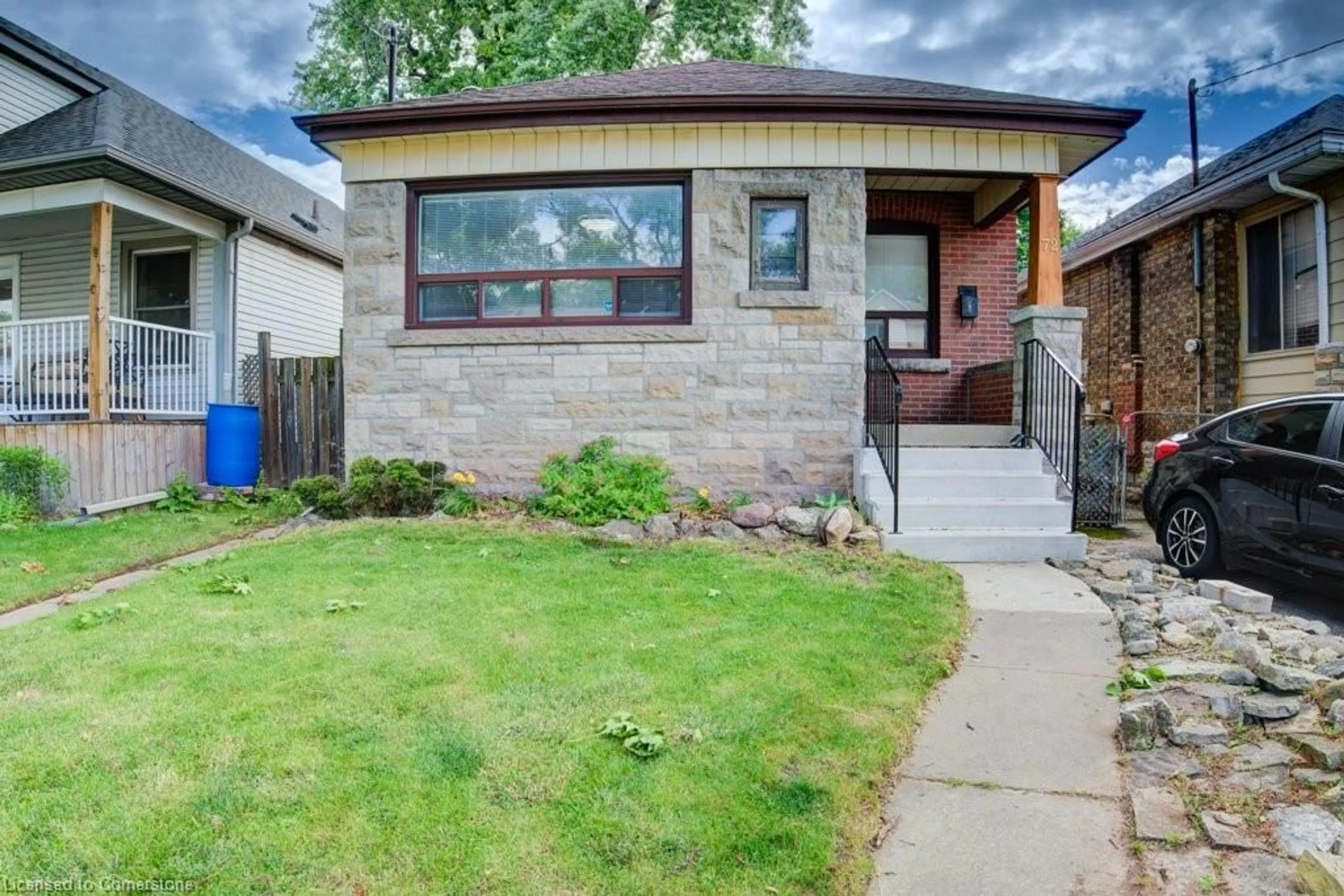 Frontside or backside of a home, the fenced backyard for 72 Edgemont St, Hamilton Ontario L8H 4C8