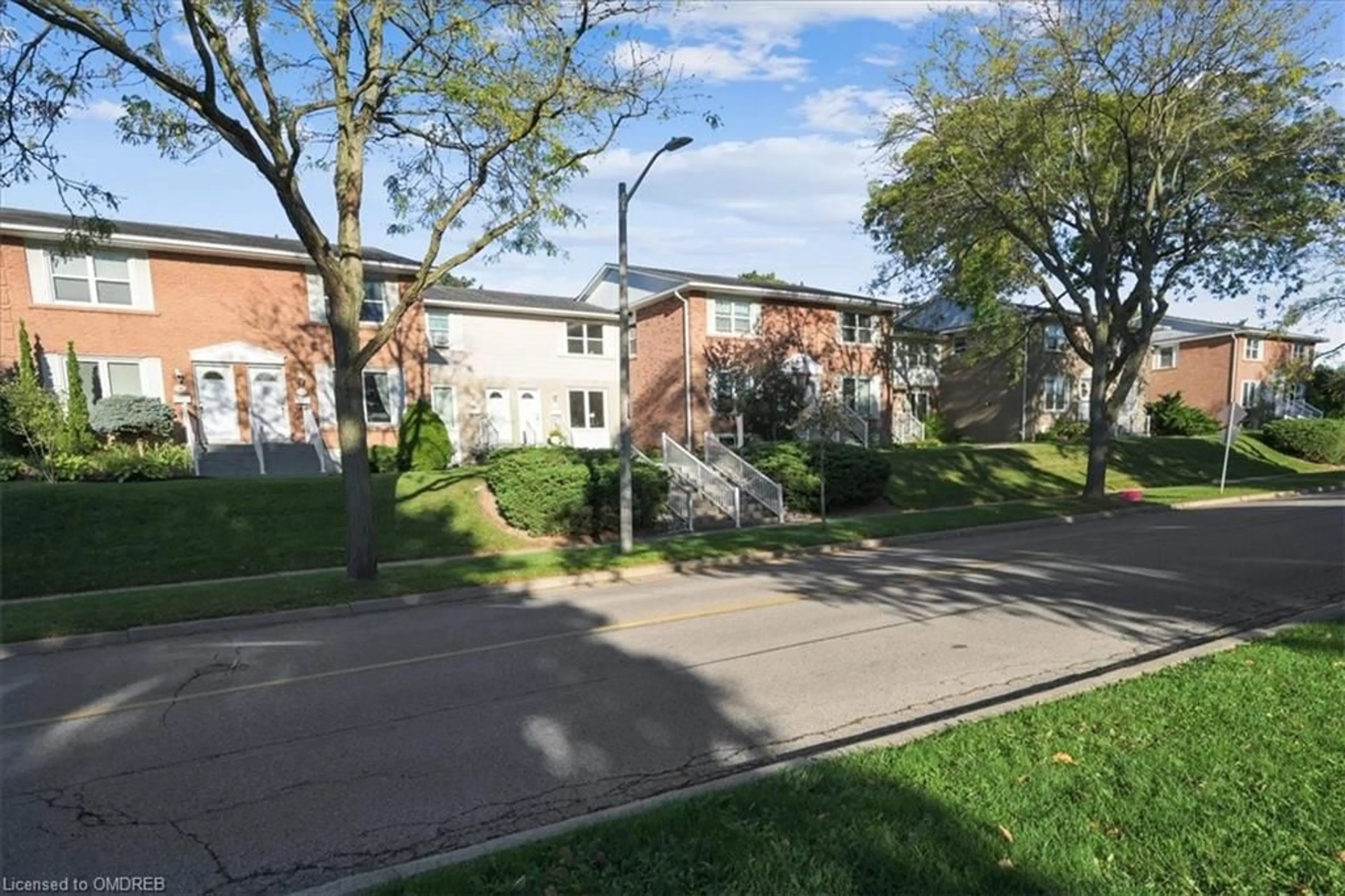 A pic from exterior of the house or condo, the street view for 2111 Meadowbrook Rd #12, Burlington Ontario L7P 2A5