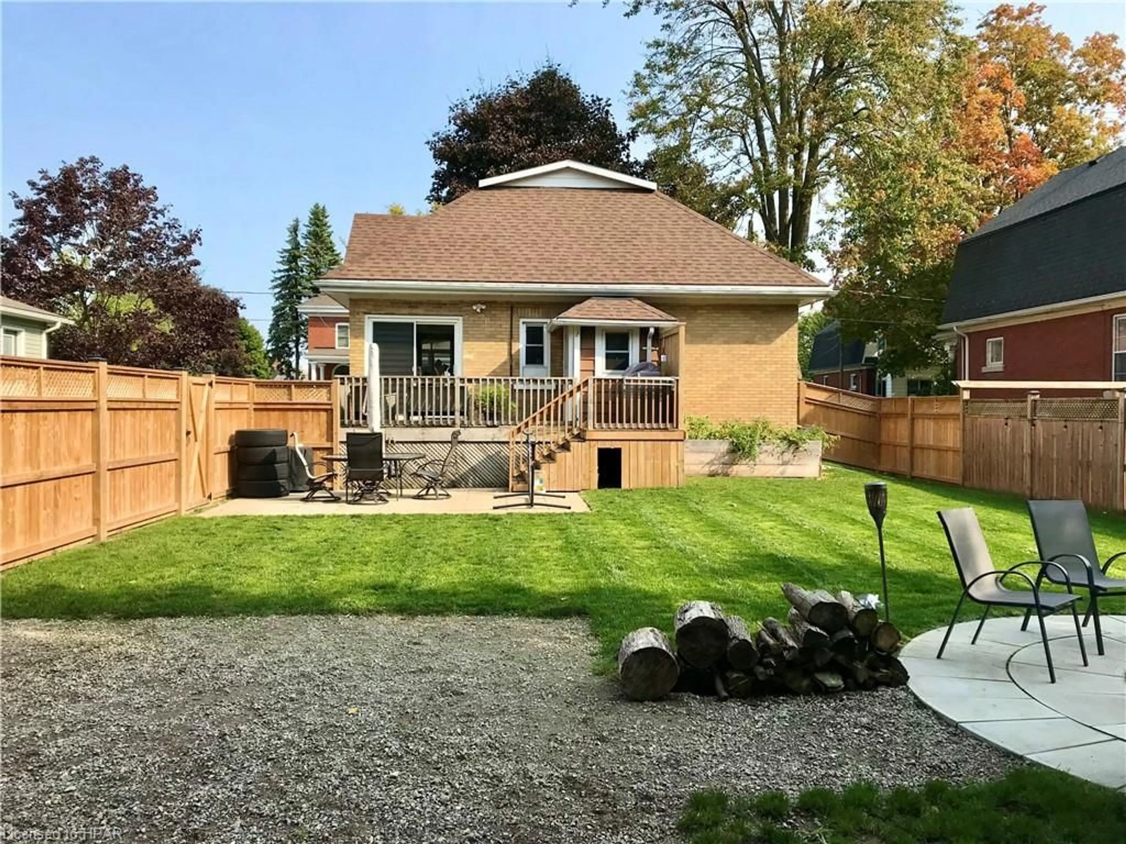 Frontside or backside of a home, the fenced backyard for 176 Trafalgar St, Mitchell Ontario N0K 1N0