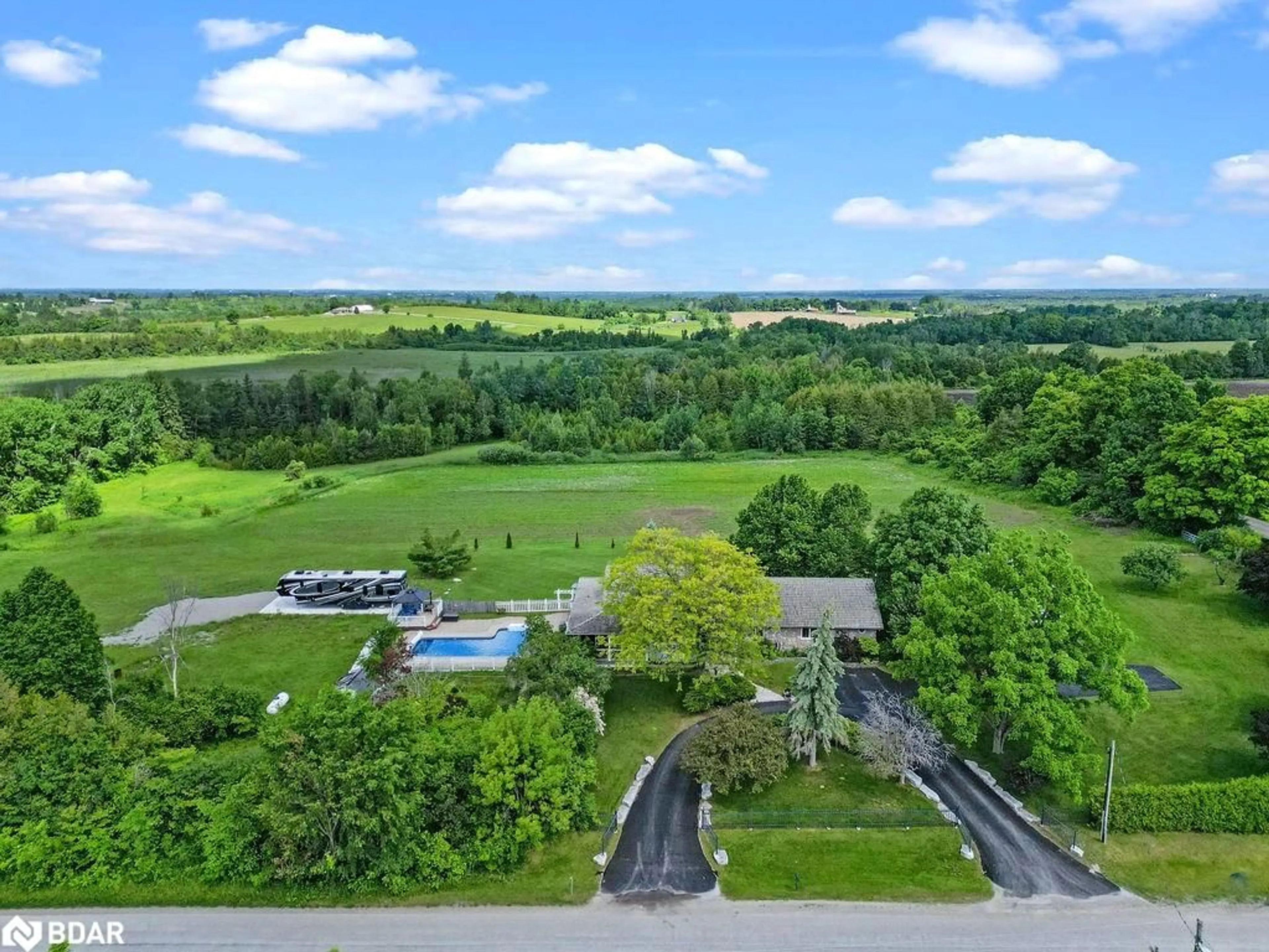 A pic from exterior of the house or condo, the fenced backyard for 593 Pigeon Creek Rd, Janetville Ontario L0B 1K0