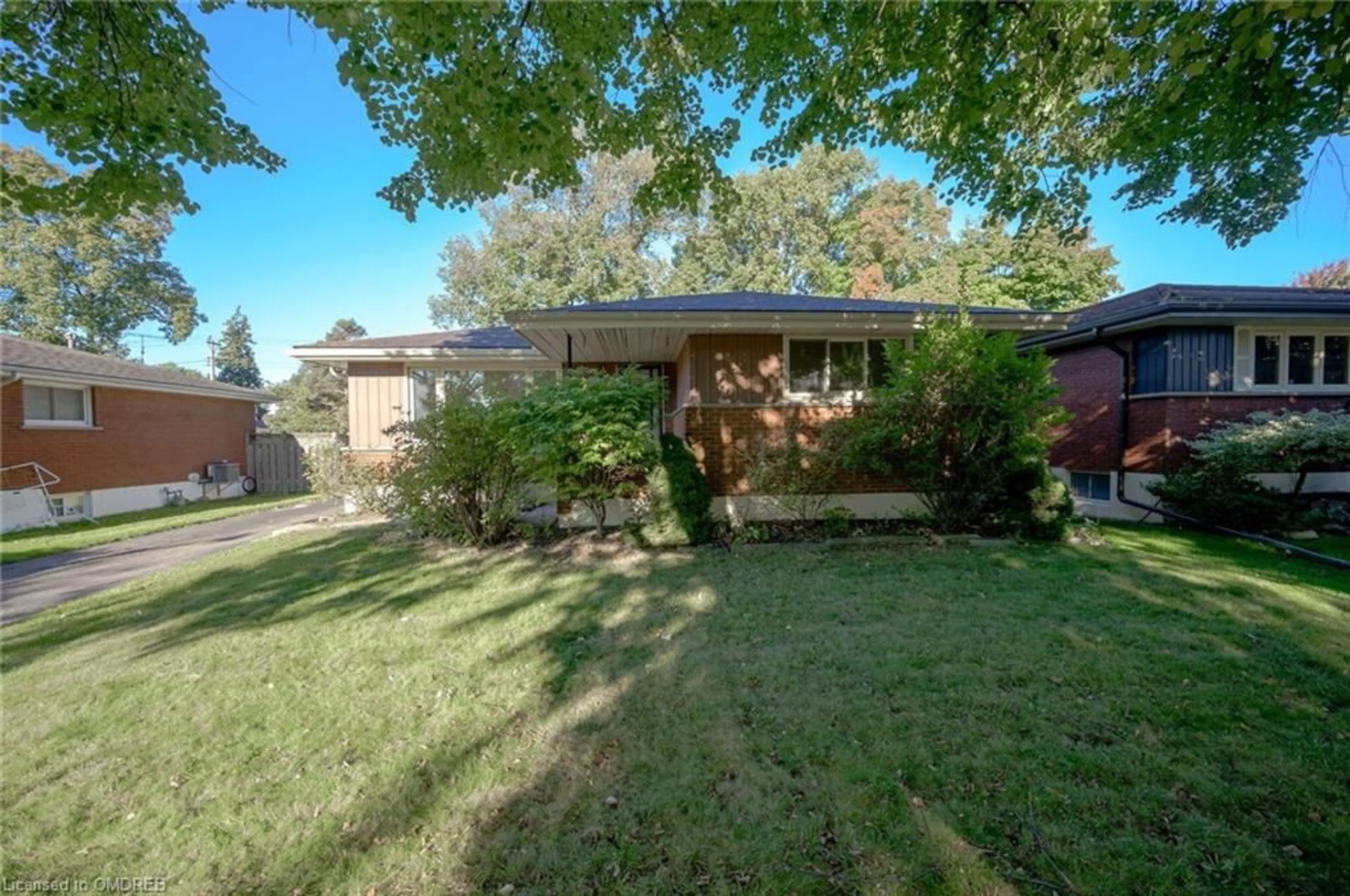 Frontside or backside of a home, the fenced backyard for 26 Carousel Ave, Hamilton Ontario L9A 4L5