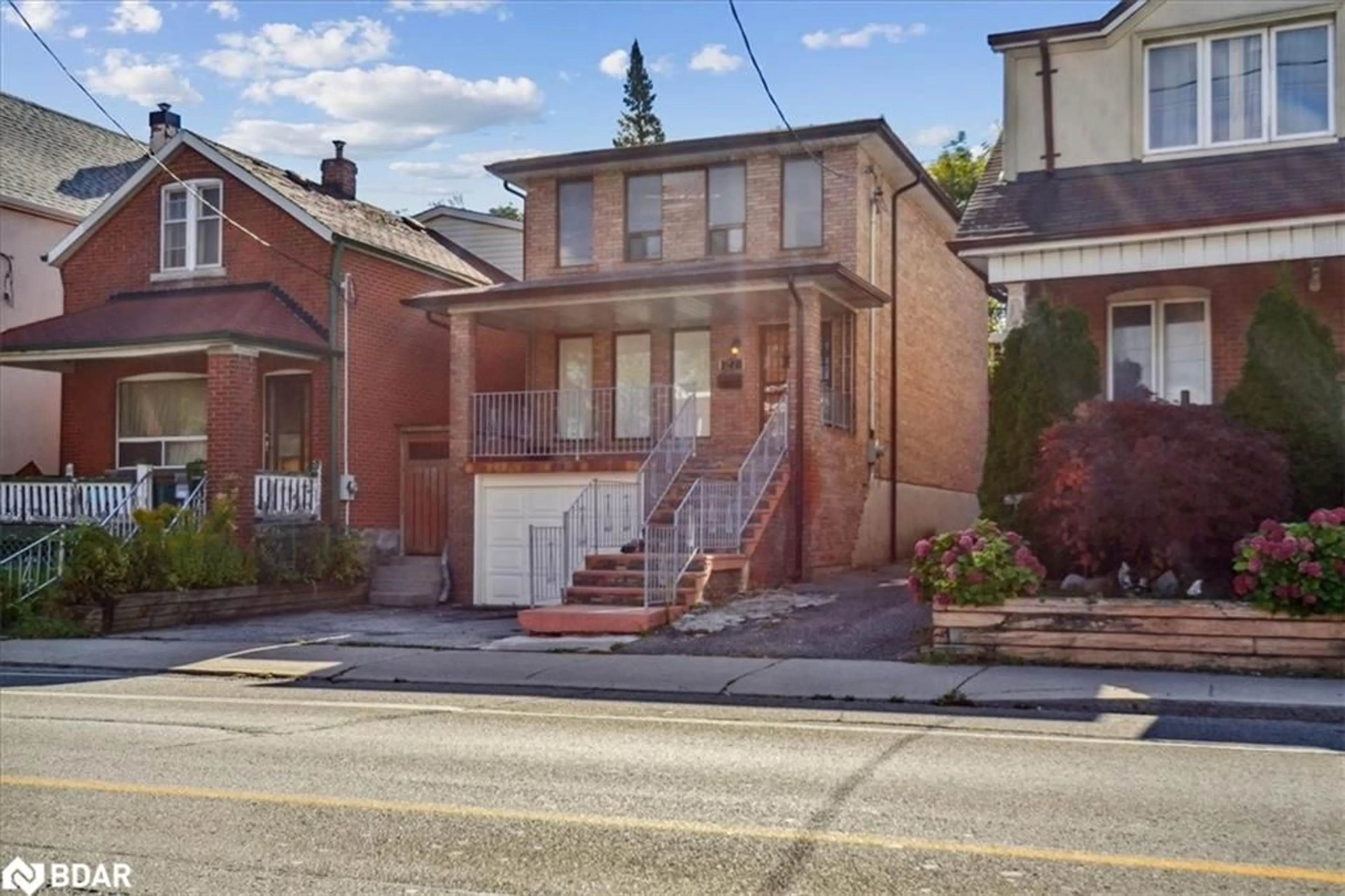 Frontside or backside of a home, the street view for 27 Rogers Rd, York Ontario M6E 1N5