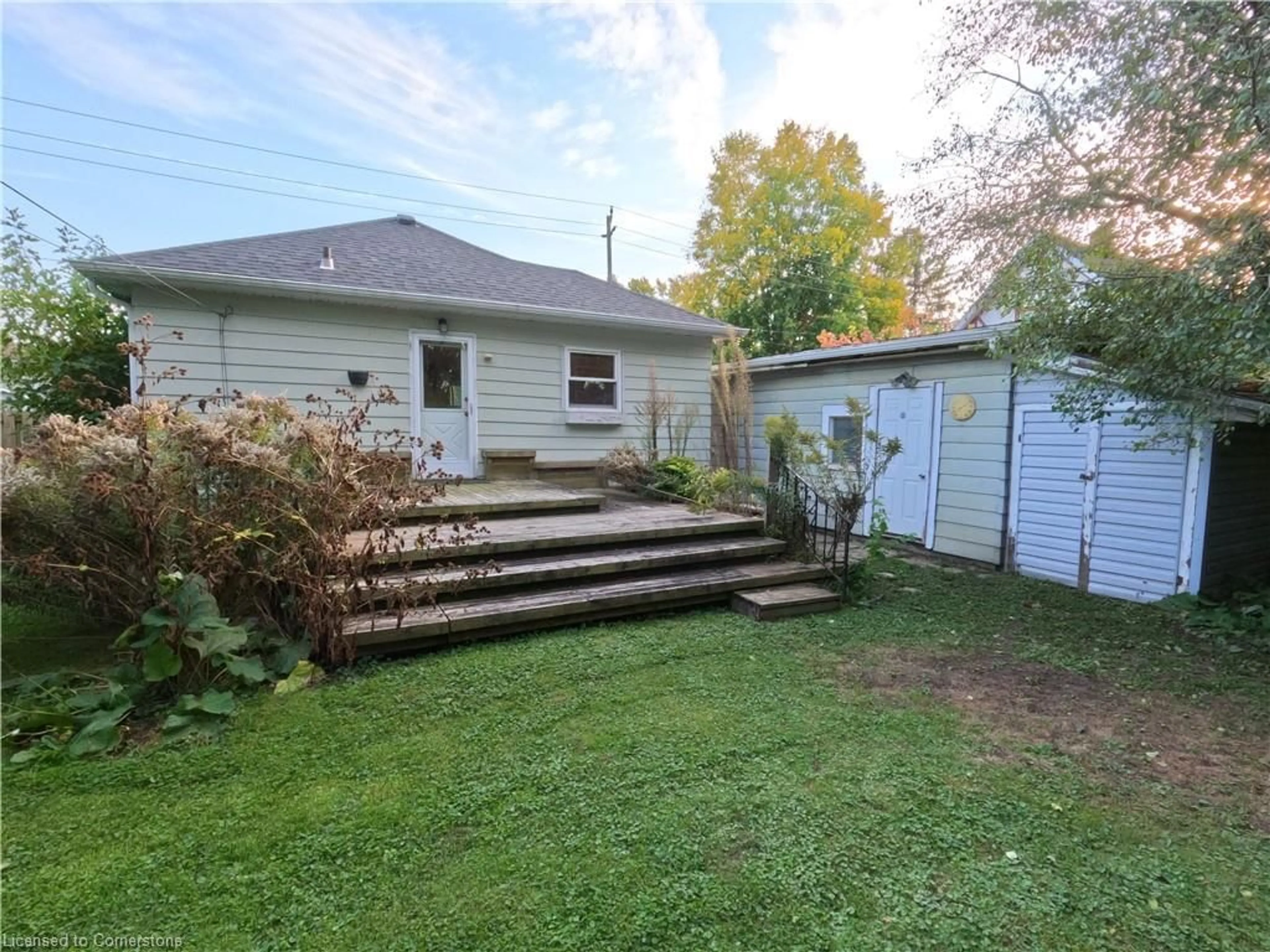 Frontside or backside of a home, the fenced backyard for 173 Canterbury St, Ingersoll Ontario N5C 1E2