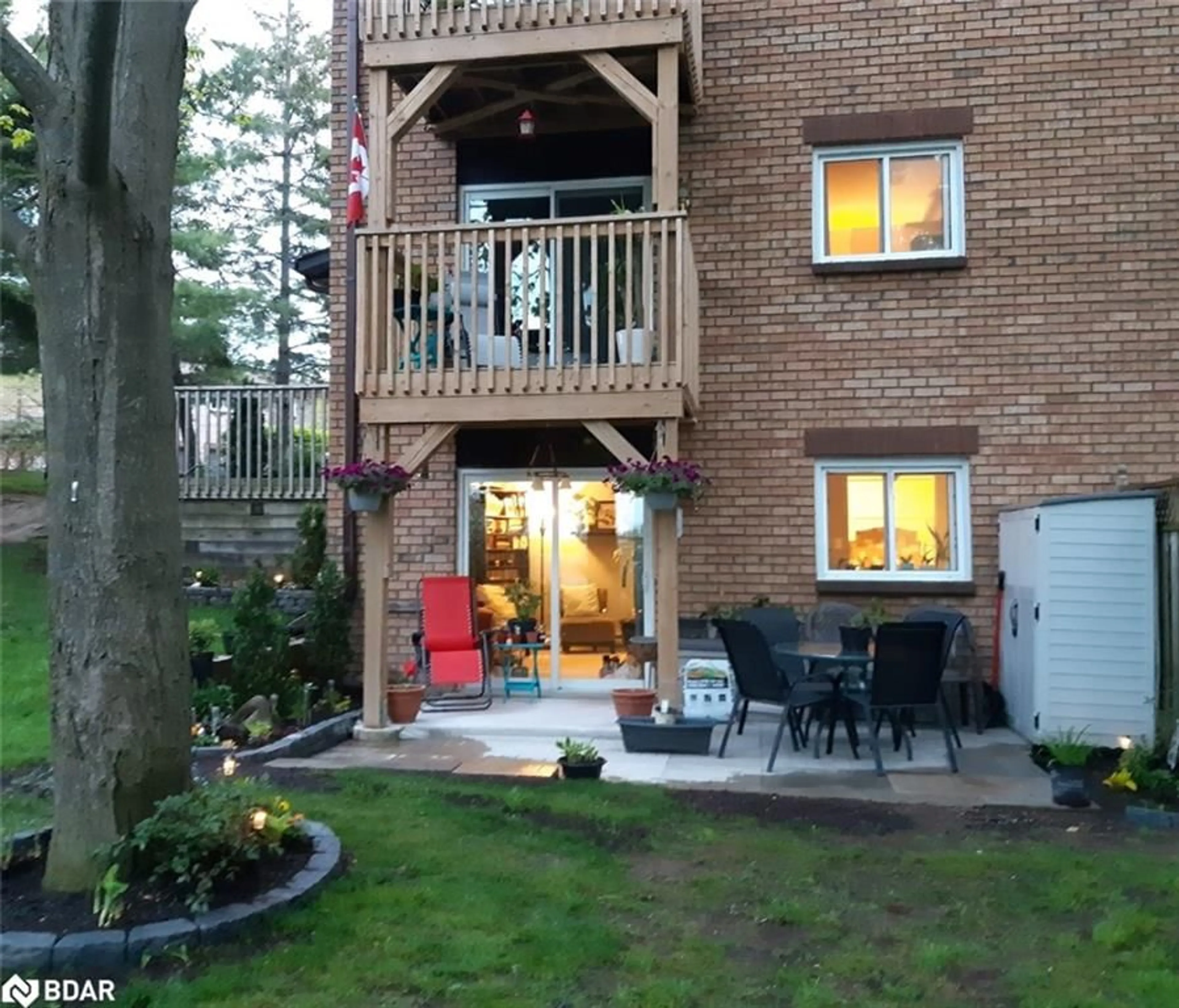 A pic from exterior of the house or condo, the fenced backyard for 30 Loggers Run #8, Barrie Ontario L4N 6W2