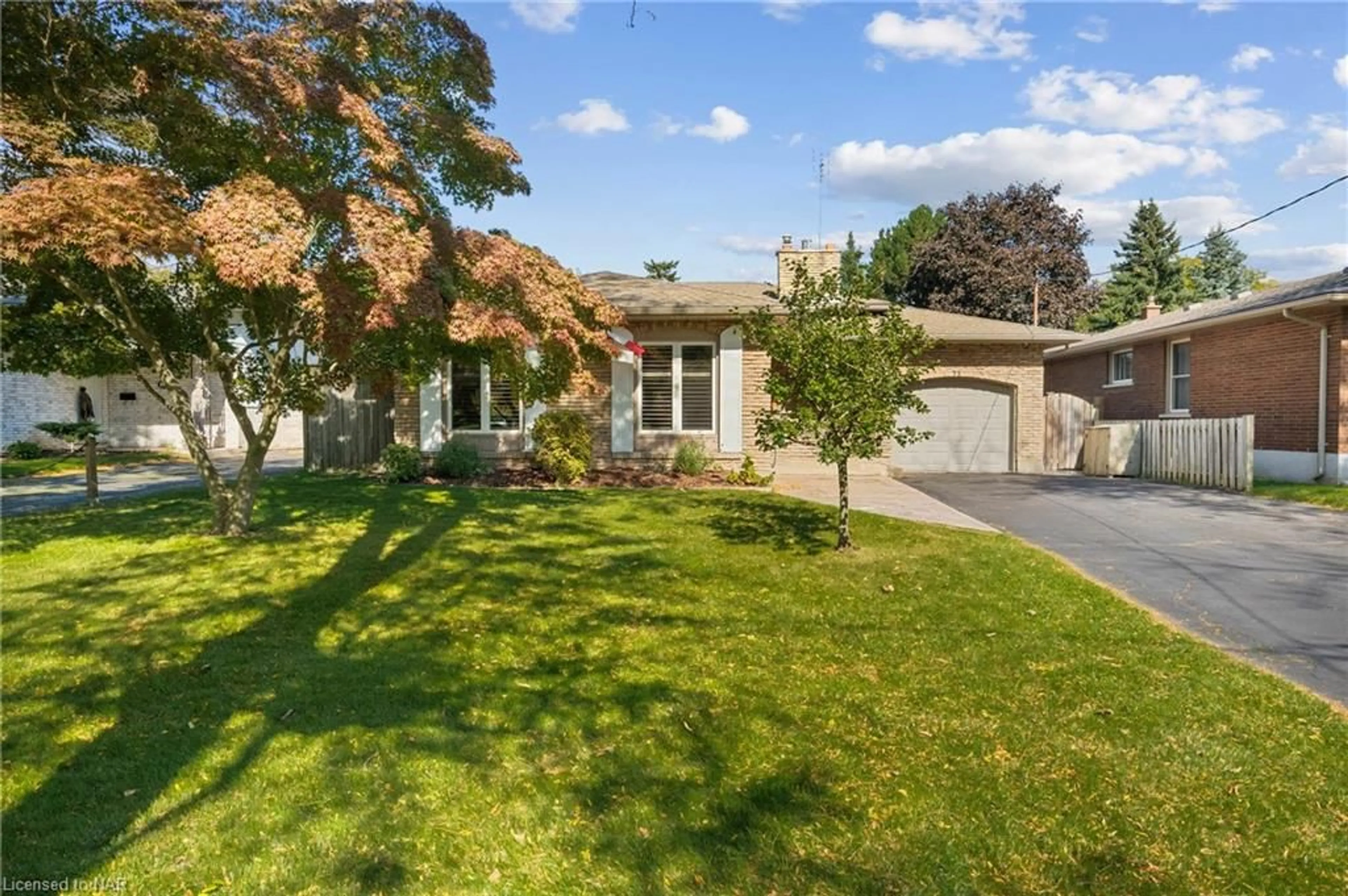 Frontside or backside of a home, the fenced backyard for 75 Aquadale Dr, St. Catharines Ontario L2N 3R9