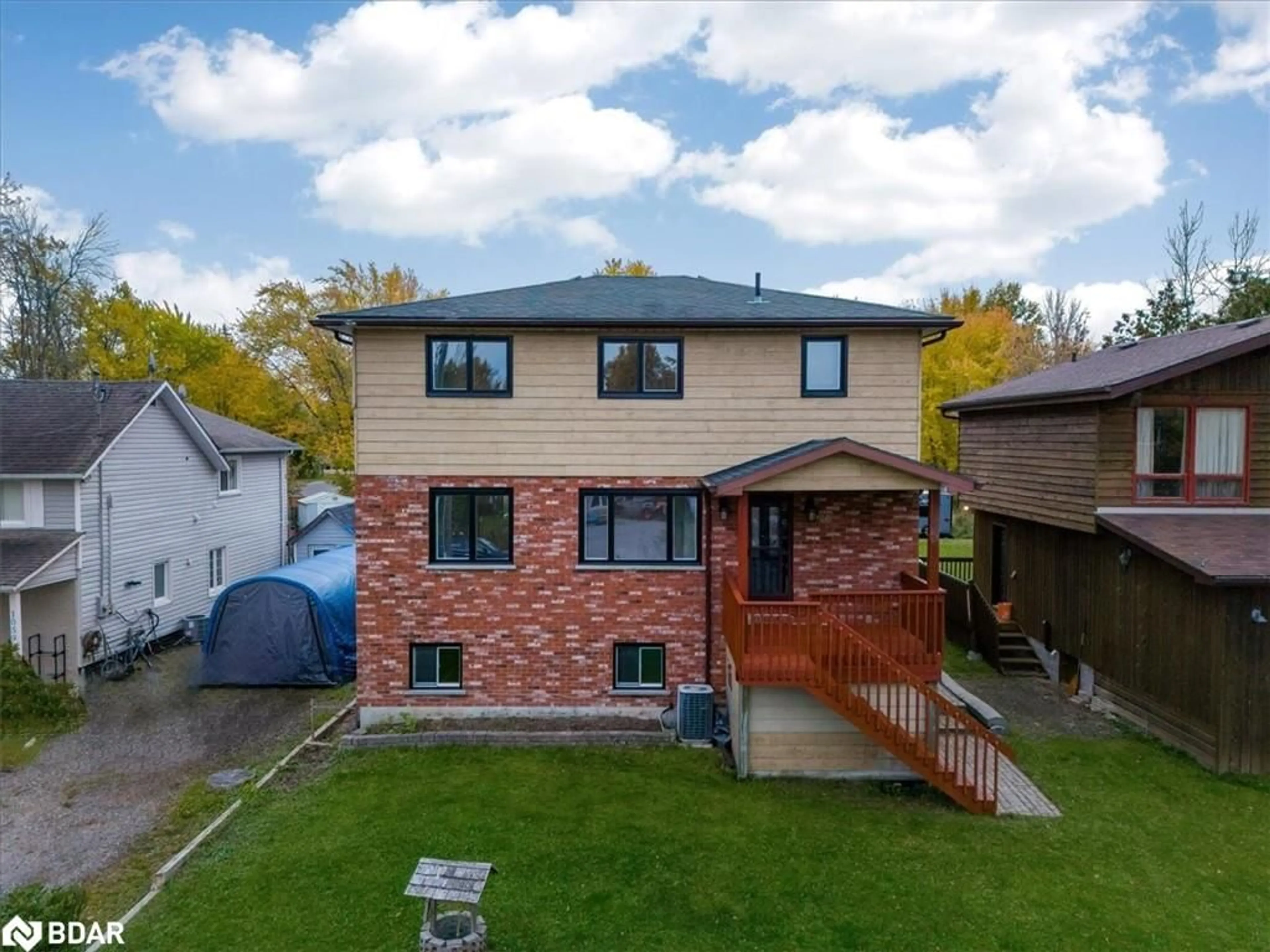 Frontside or backside of a home, the fenced backyard for 1063 Wood St, Innisfil Ontario L0L 1K0