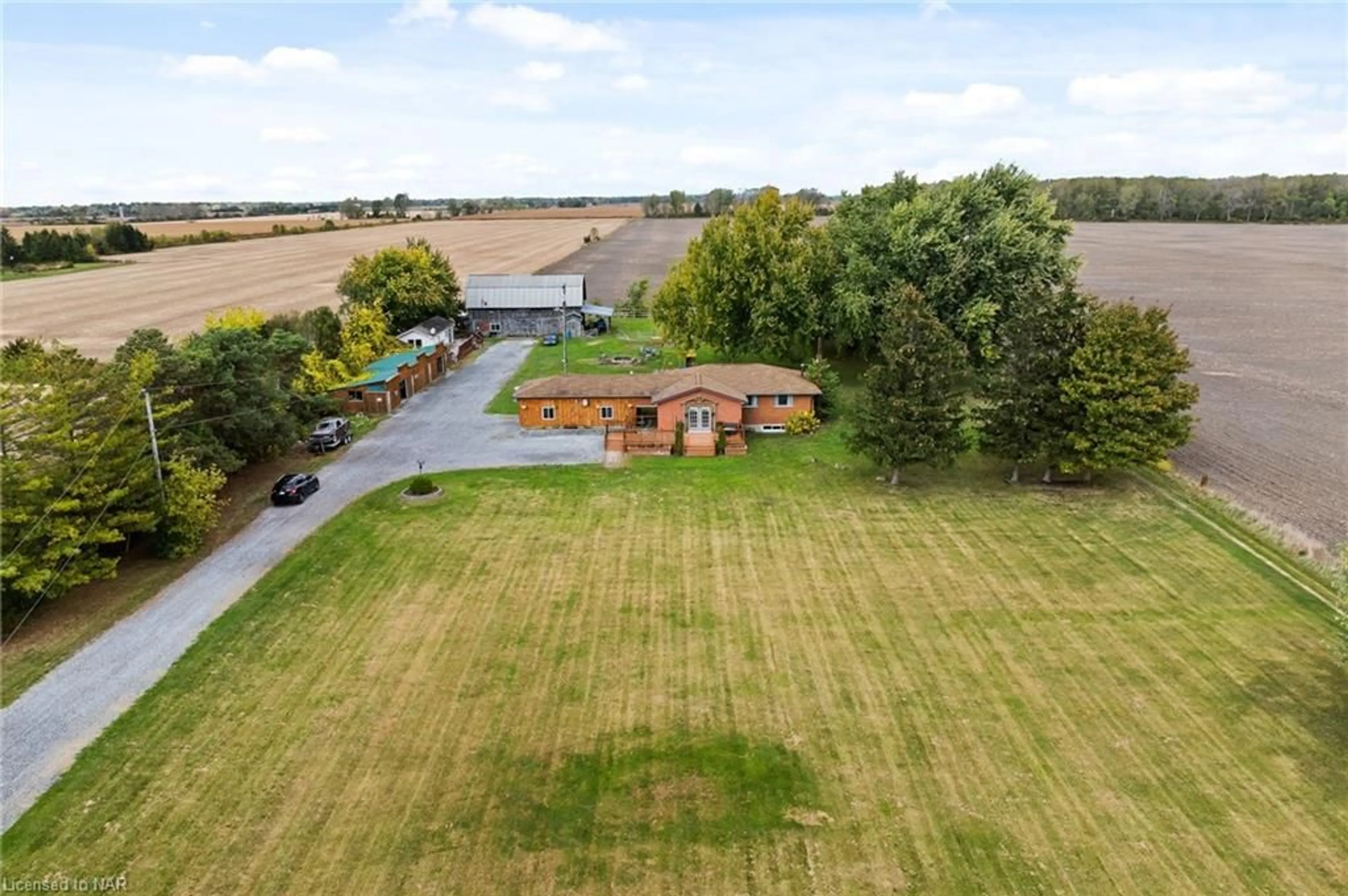 Frontside or backside of a home, the fenced backyard for 11366 Highway 3 West, Wainfleet Ontario L3K 5V4