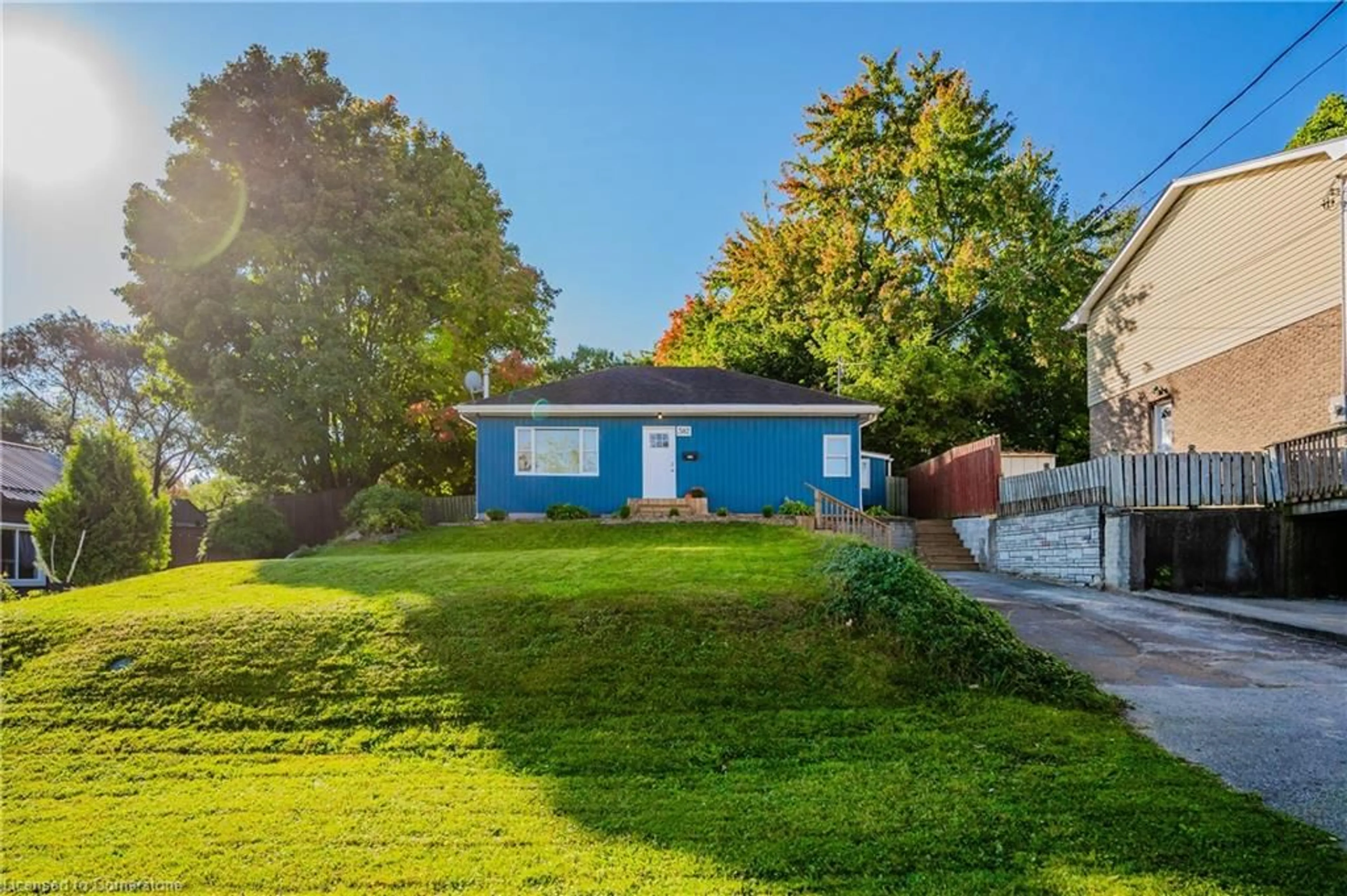 Frontside or backside of a home, the fenced backyard for 302 Hay St, Woodstock Ontario N4S 2B9