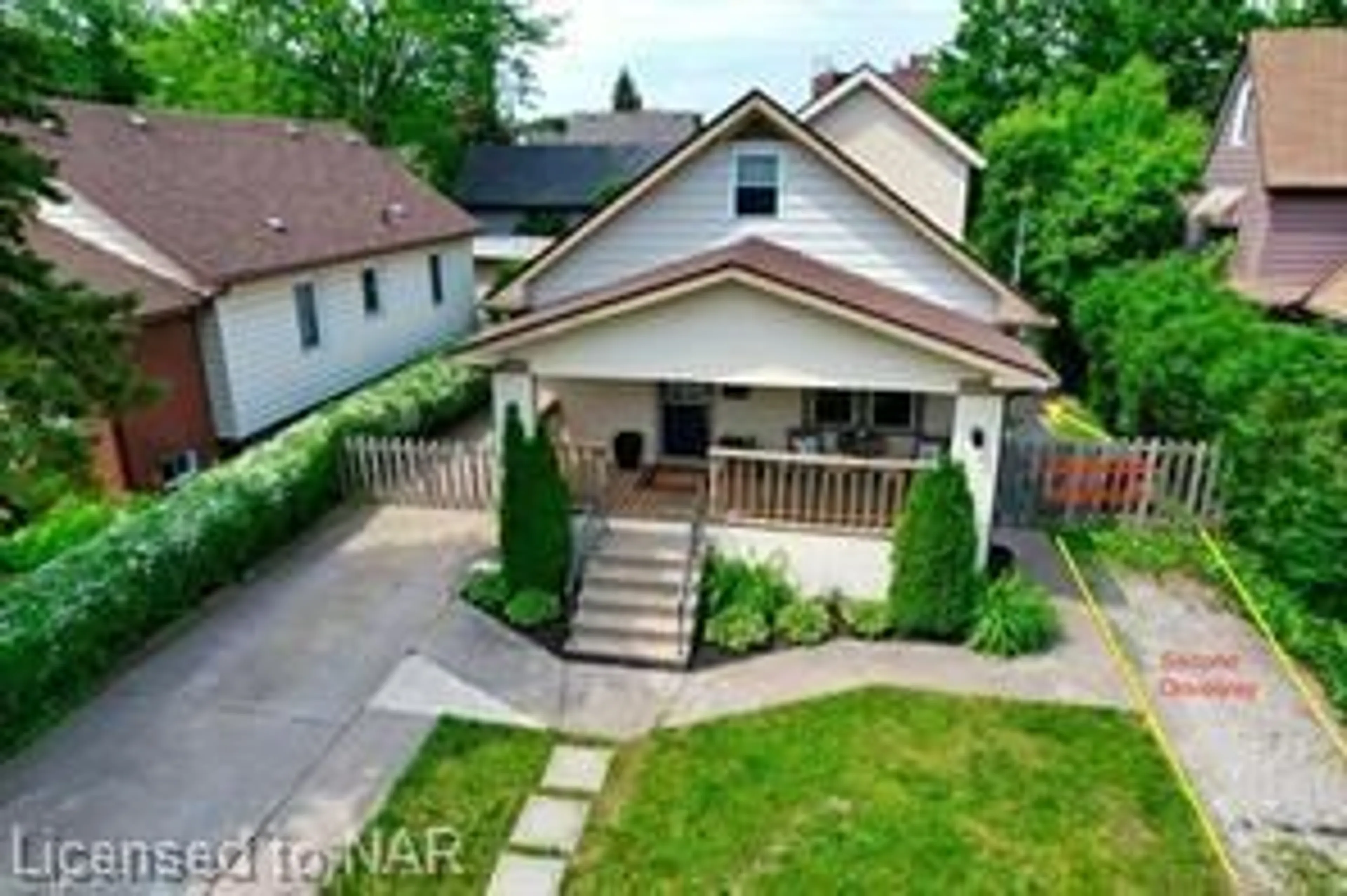 Frontside or backside of a home, the fenced backyard for 6251 Crawford St, Niagara Falls Ontario L2E 5Y5