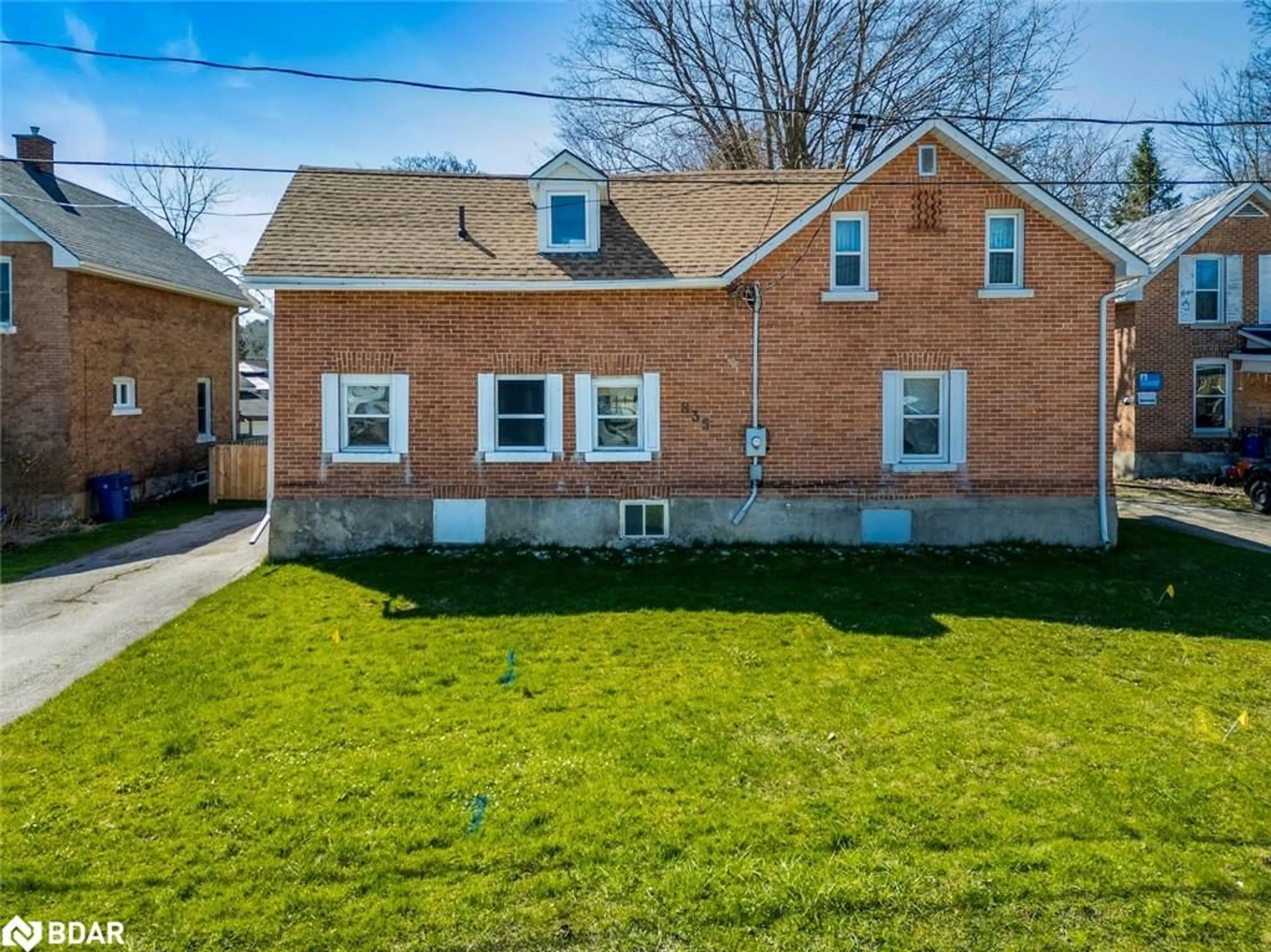 Frontside or backside of a home, the fenced backyard for 835 11th St, Owen Sound Ontario N4K 3T4