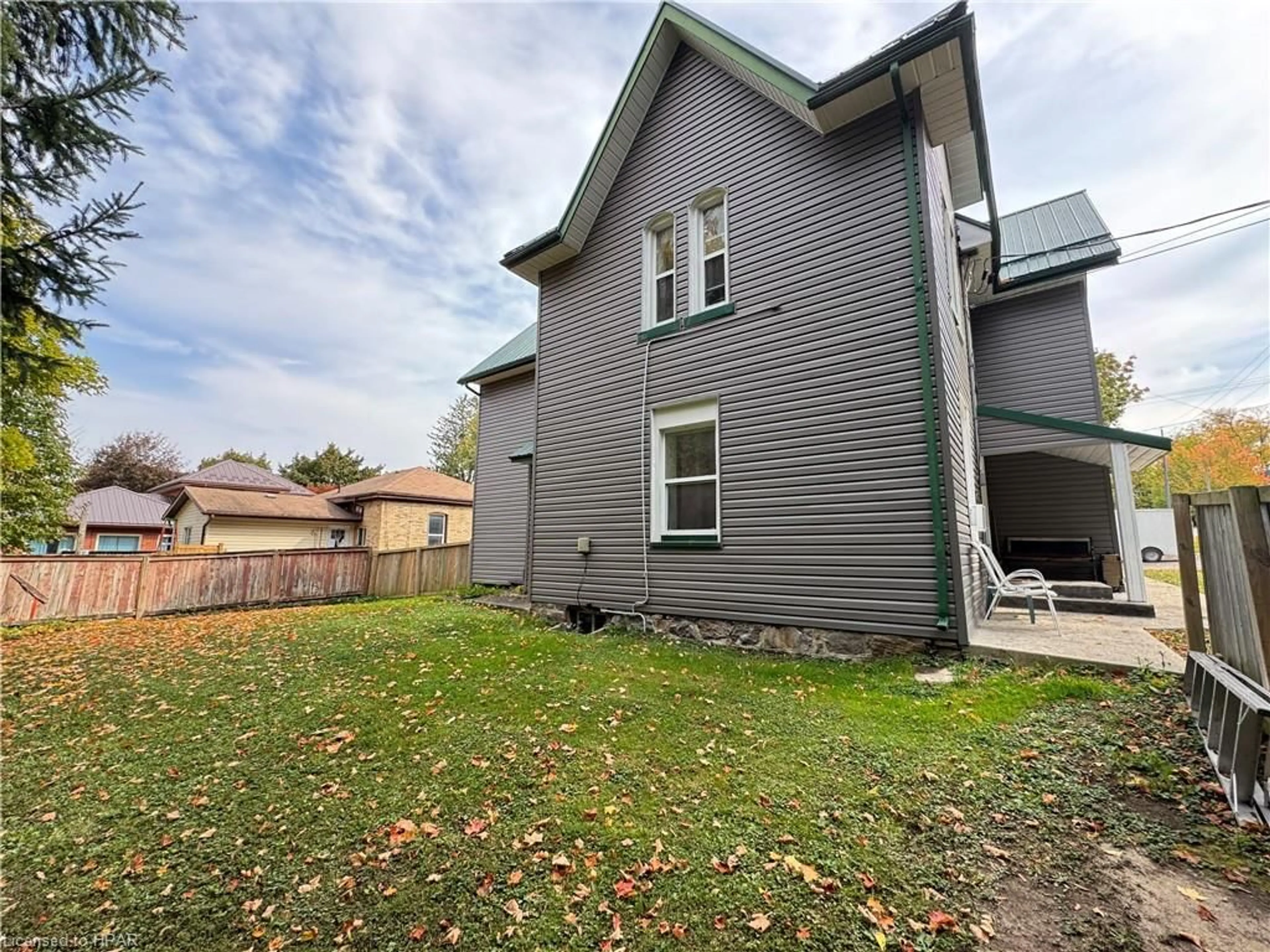 Frontside or backside of a home, the fenced backyard for 103 Patrick St, Wingham Ontario N0G 2W0