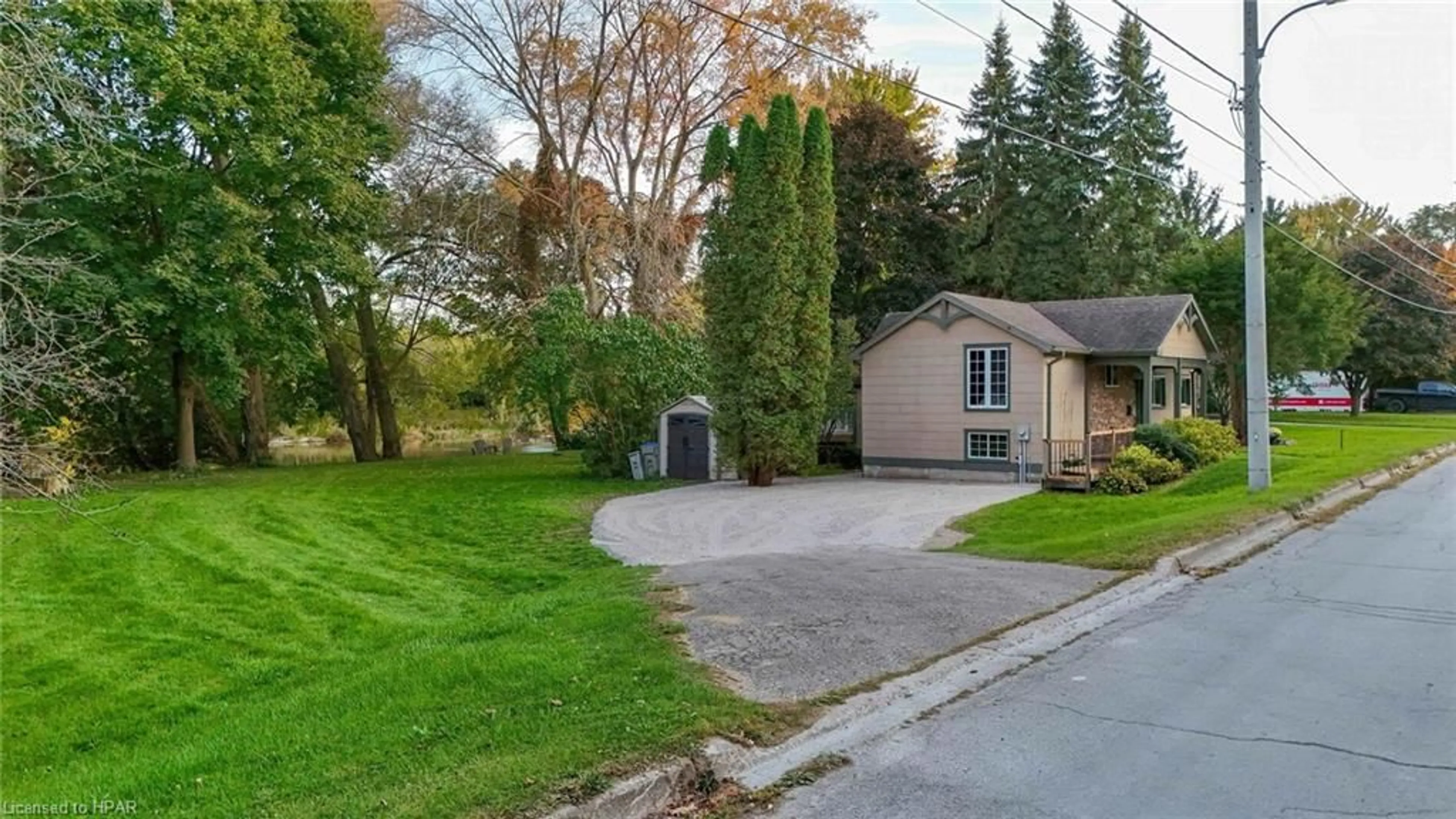 Frontside or backside of a home, the fenced backyard for 165 Thomas St, St. Marys Ontario N4X 1B9