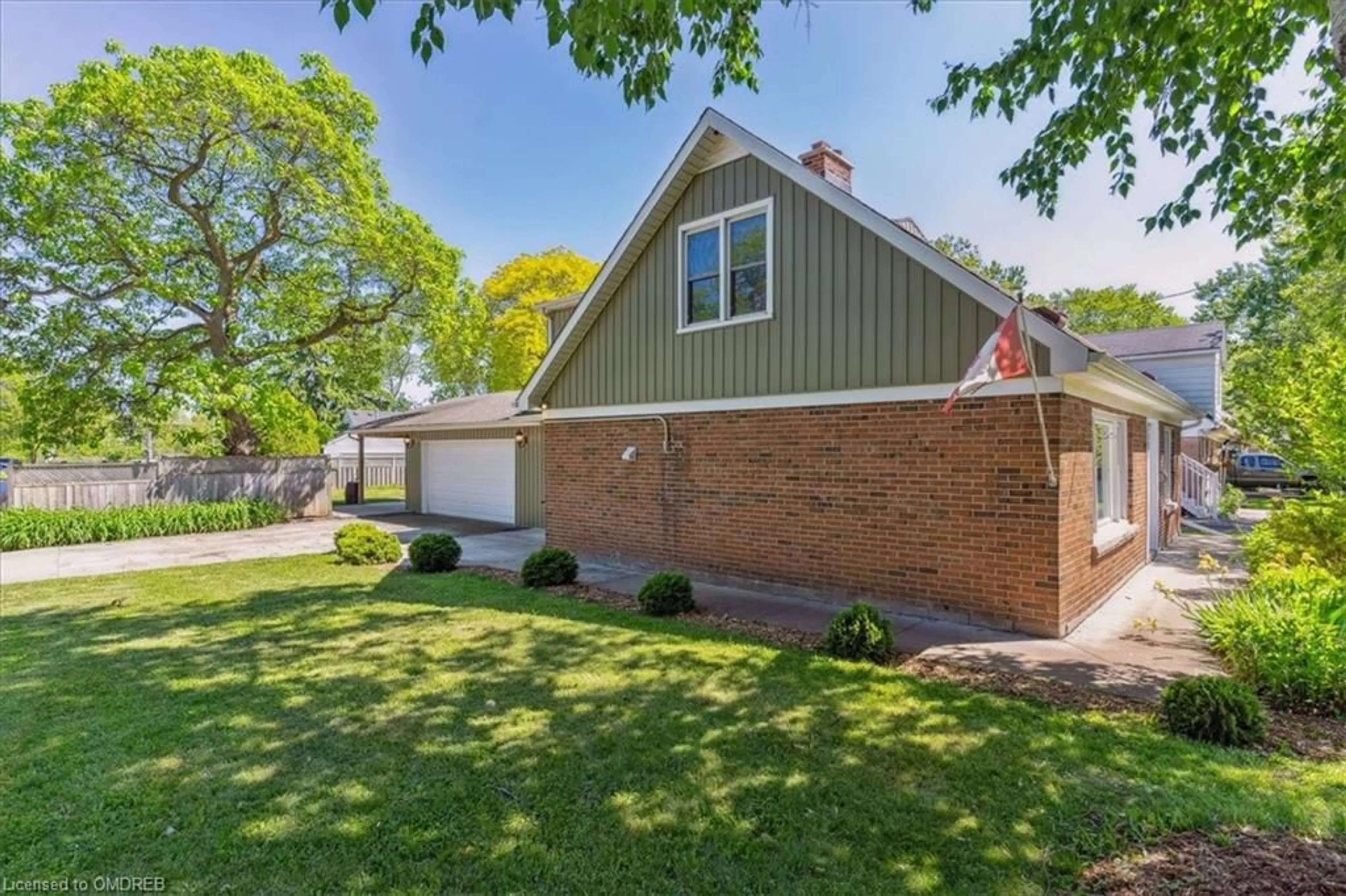 Frontside or backside of a home, the fenced backyard for 2076 Churchill Ave, Burlington Ontario L7R 3T7