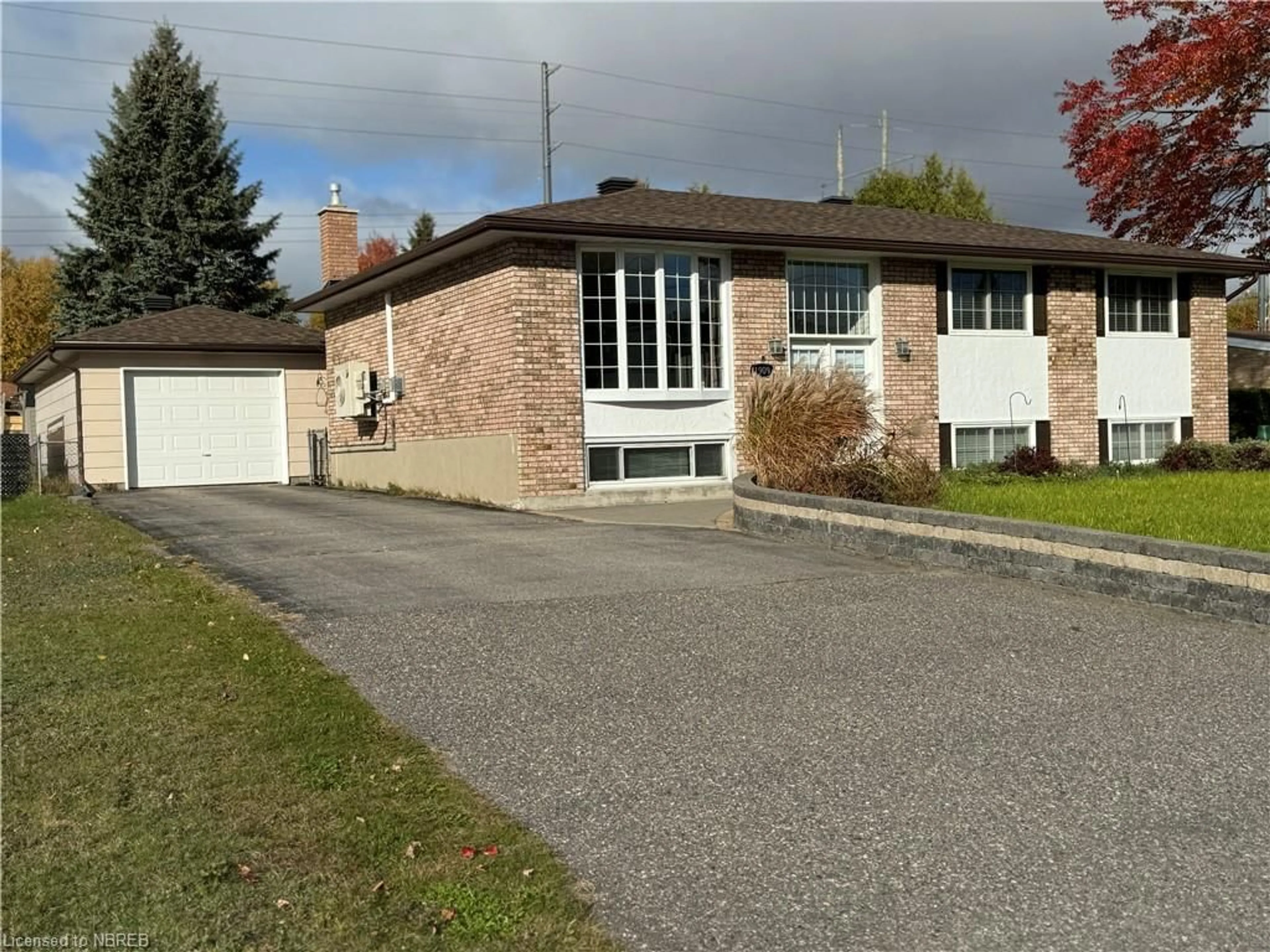 Frontside or backside of a home, the street view for 1909 Mckeown Ave, North Bay Ontario P1B 7N5