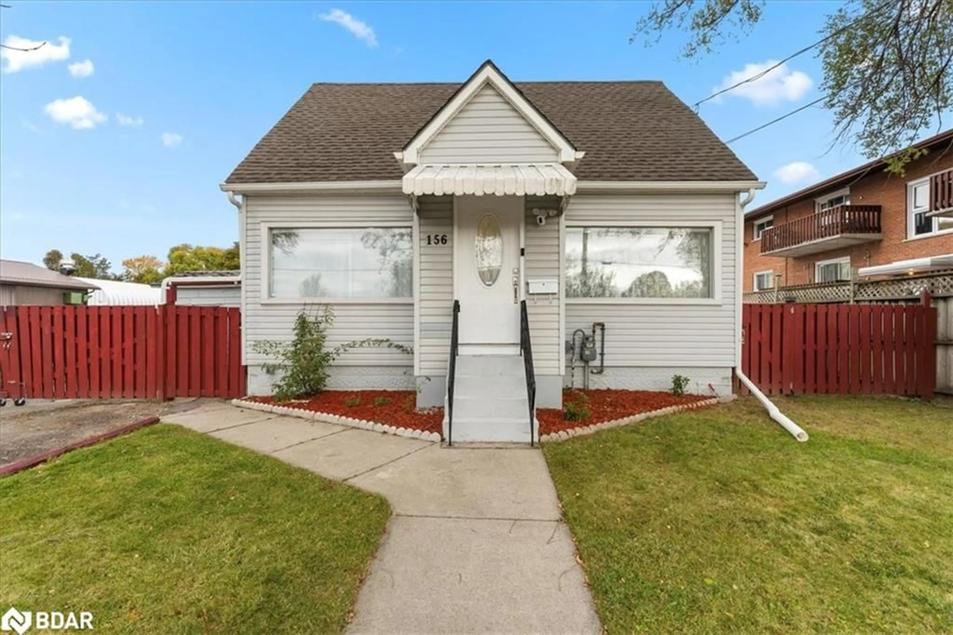 Frontside or backside of a home, the fenced backyard for 156 Catharine St, Belleville Ontario K8P 1M8