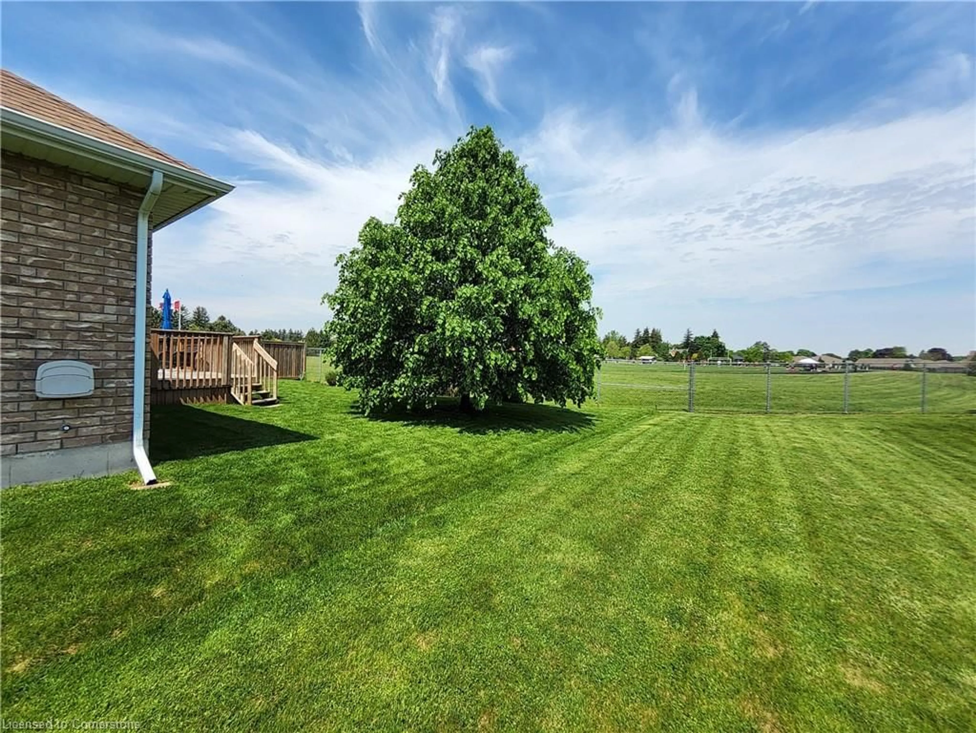 A pic from exterior of the house or condo, the fenced backyard for 39 Driftwood Dr, Simcoe Ontario N3Y 0A3