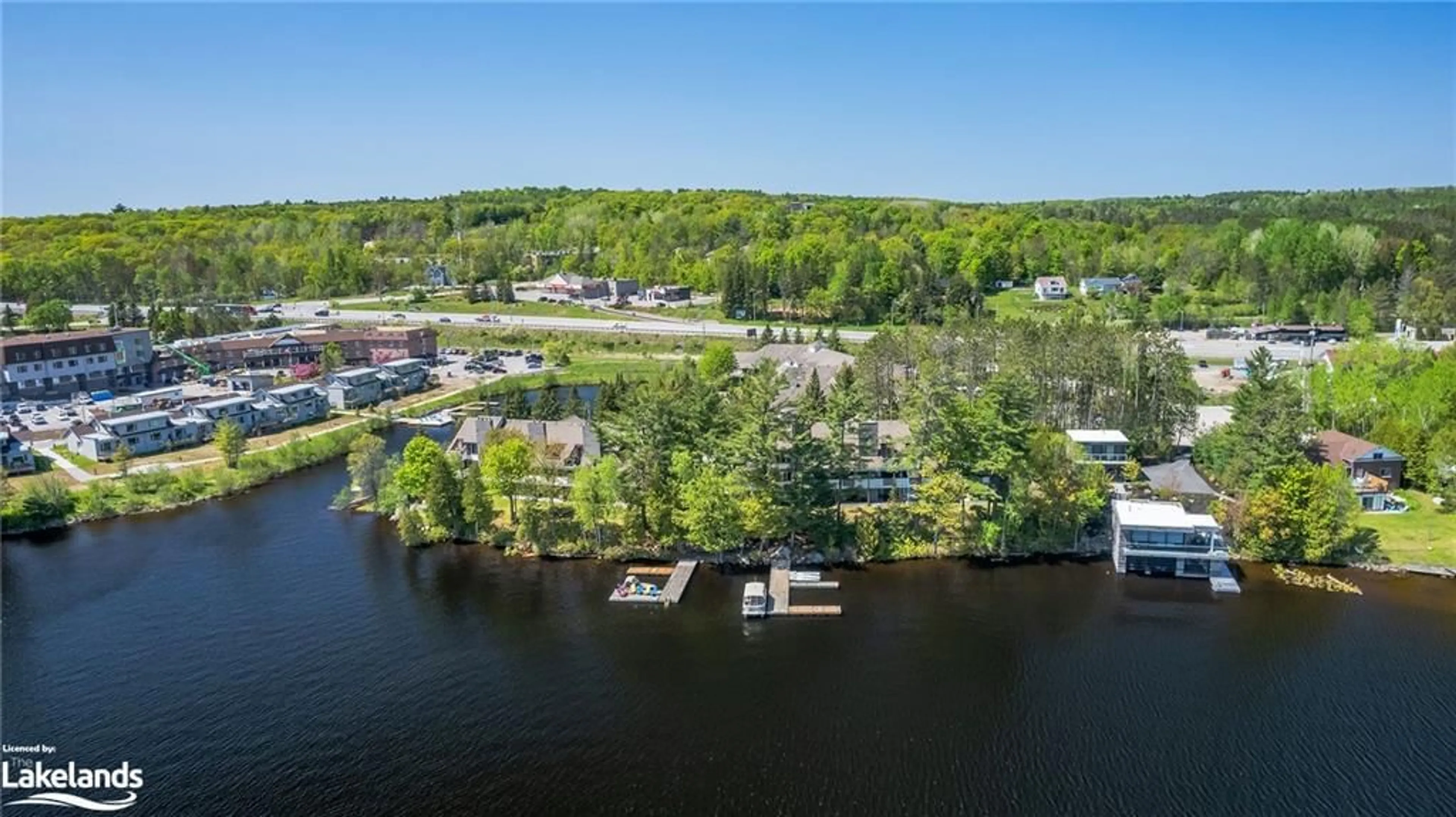 A pic from exterior of the house or condo, lake for 10 Coveside Dr #208, Huntsville Ontario P1H 1C3