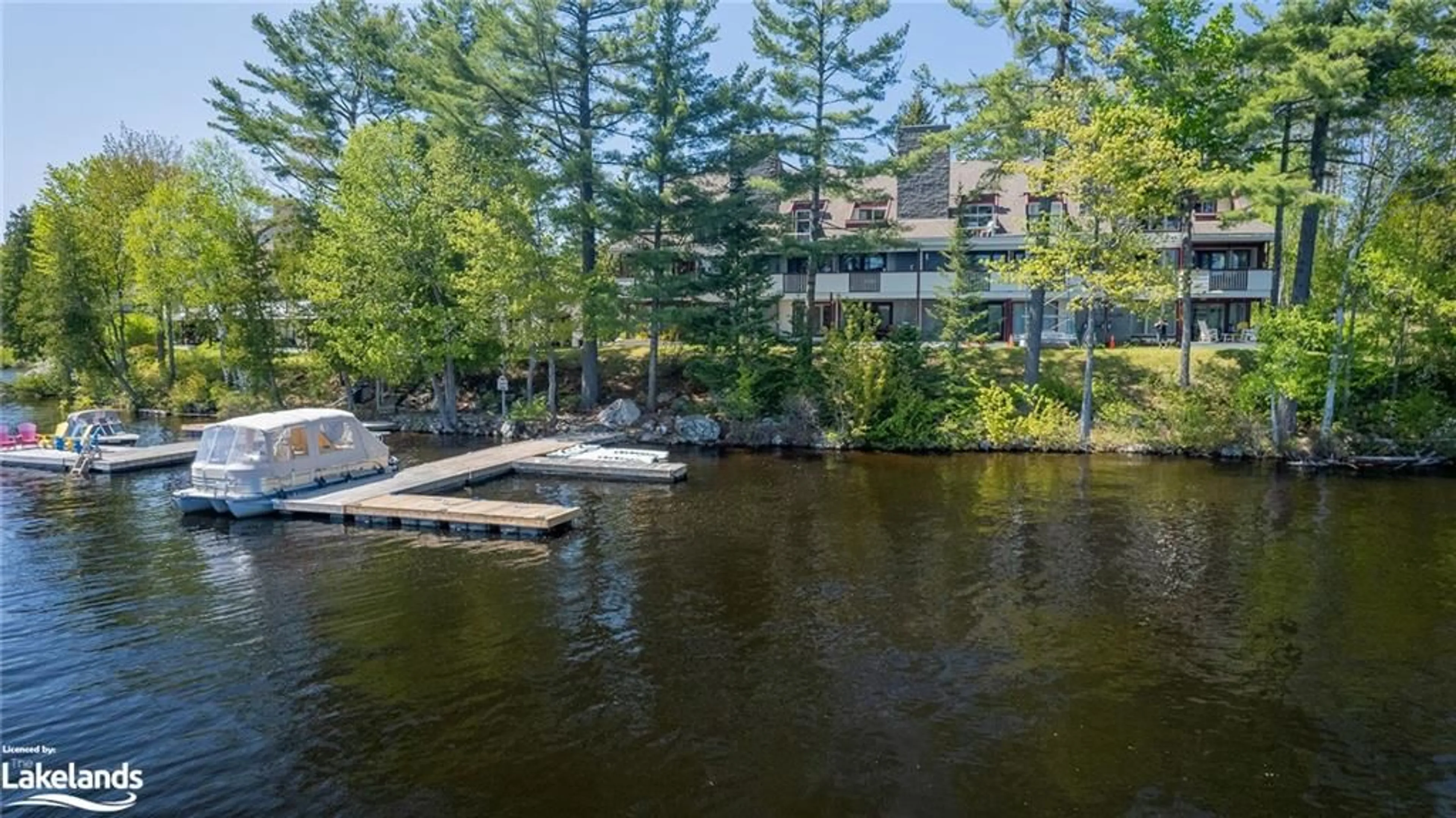 A pic from exterior of the house or condo, lake for 10 Coveside Dr #208, Huntsville Ontario P1H 1C3