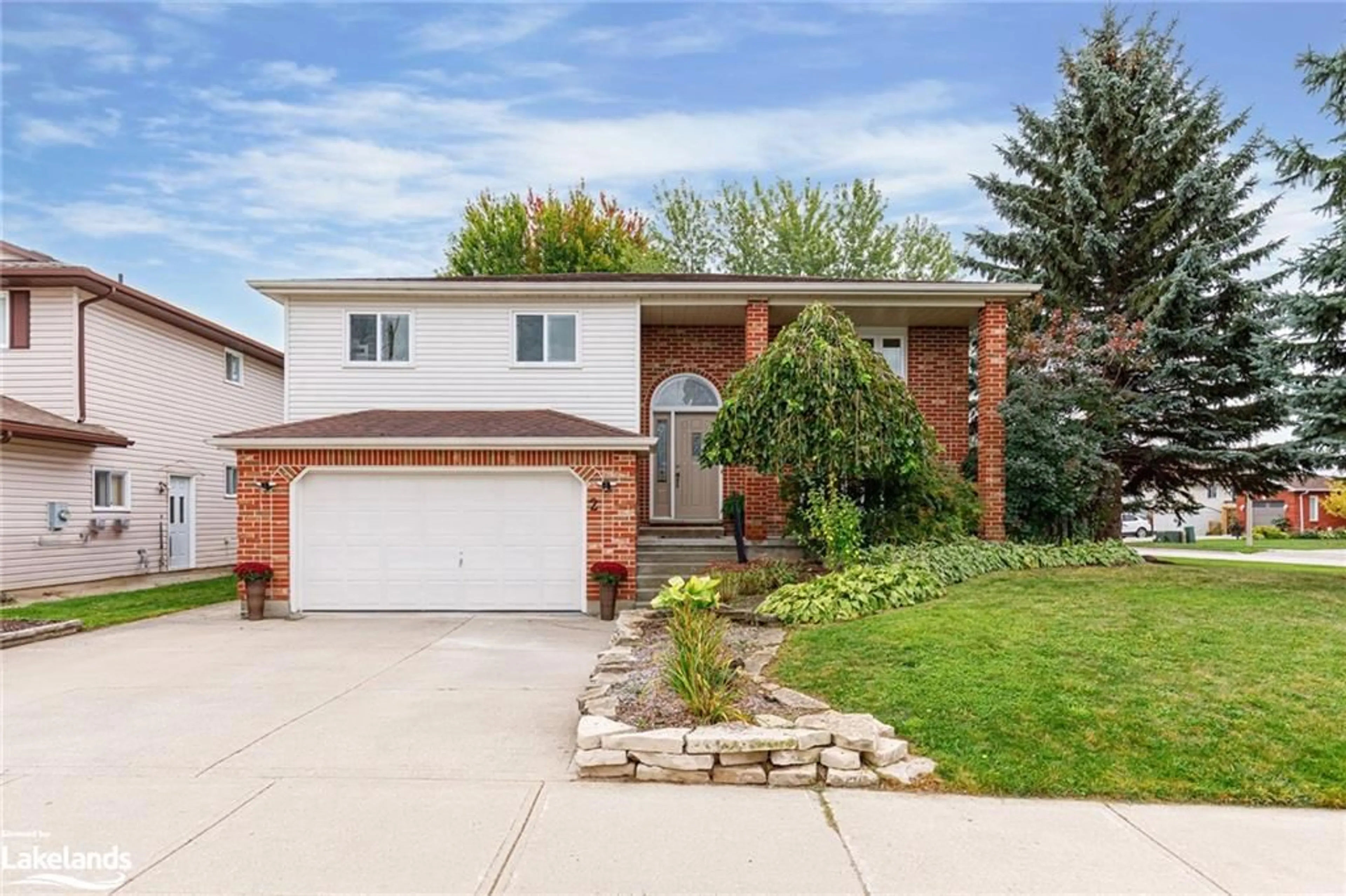 Frontside or backside of a home, the fenced backyard for 2 Bush St, Collingwood Ontario L9Y 4S9