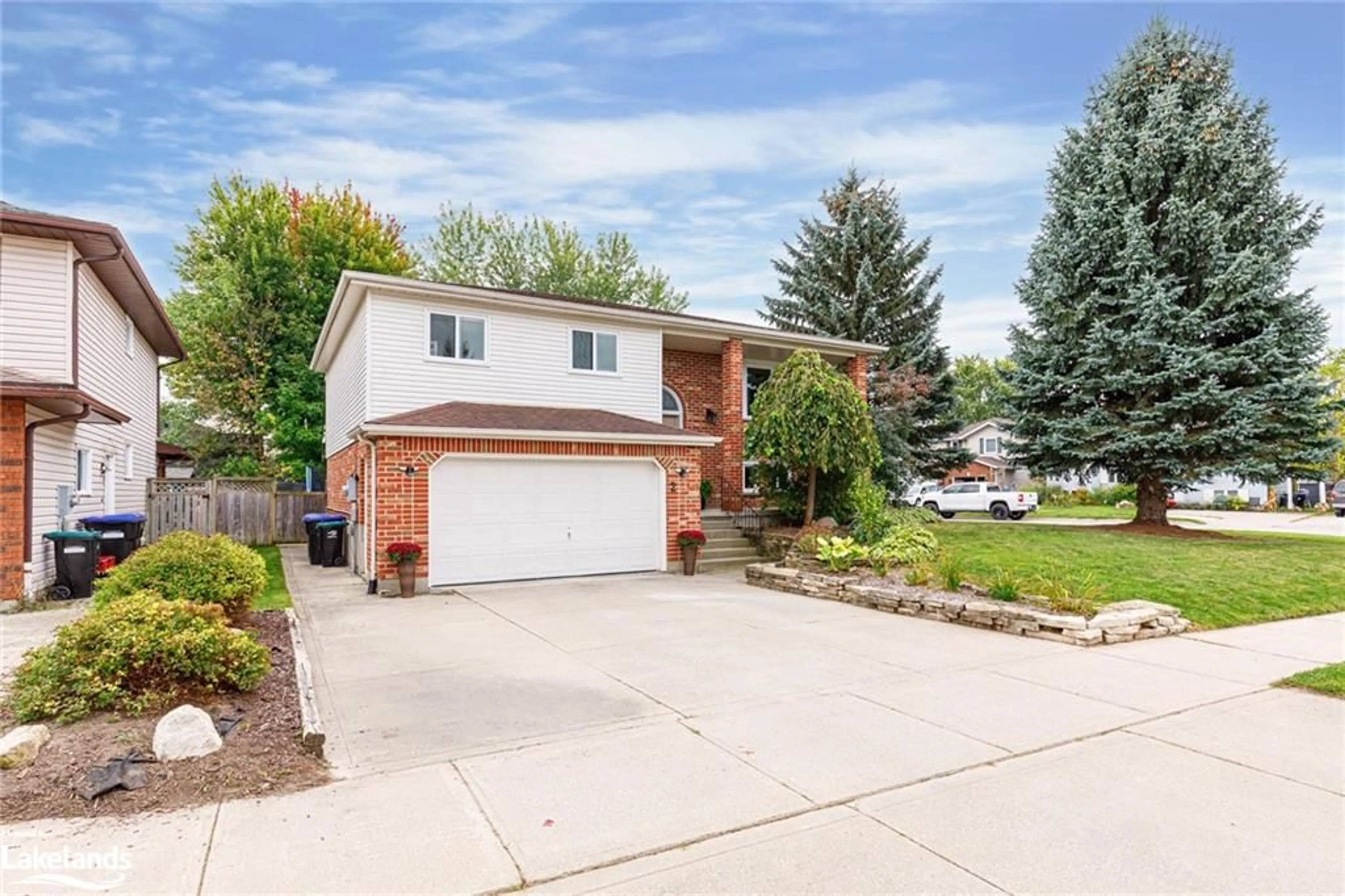 Frontside or backside of a home, the fenced backyard for 2 Bush St, Collingwood Ontario L9Y 4S9