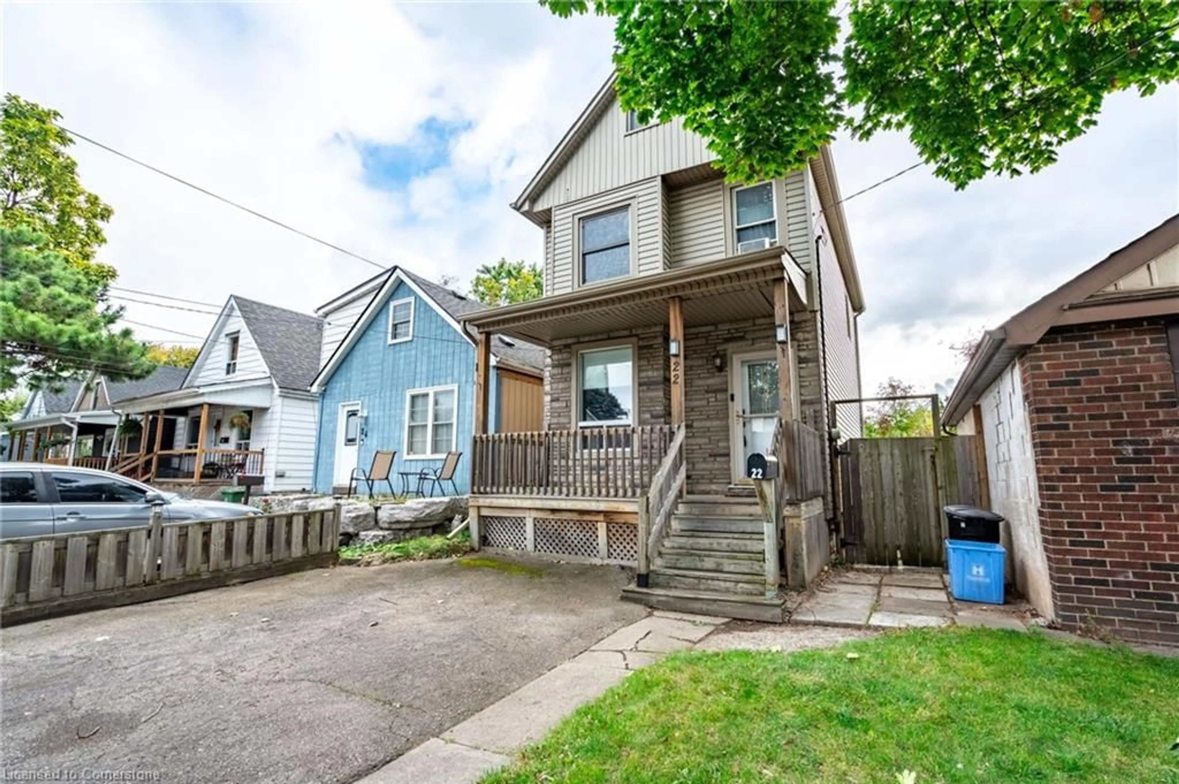 Frontside or backside of a home, the fenced backyard for 22 Bayfield Ave, Hamilton Ontario L8H 3M4