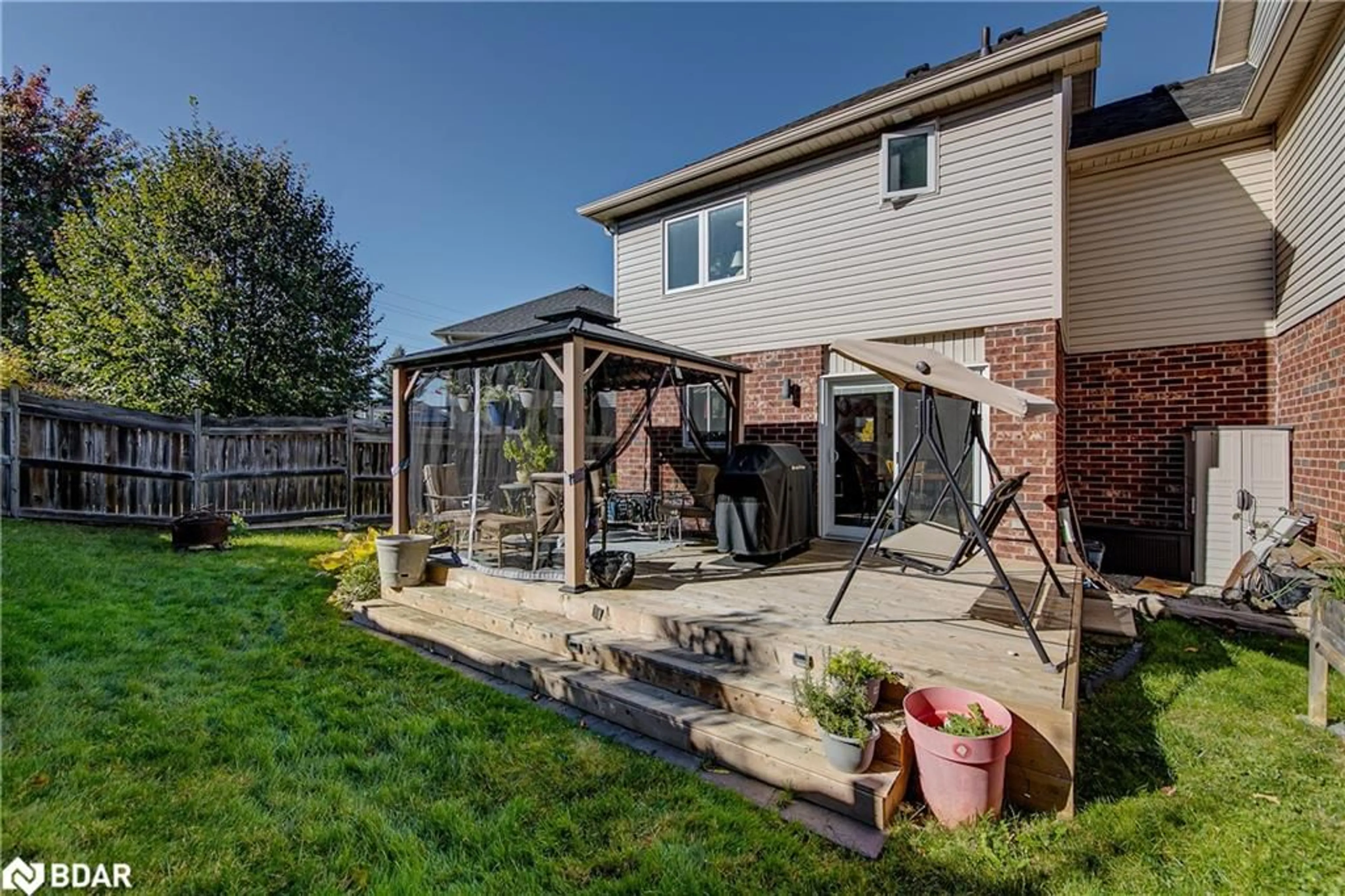 Patio, the fenced backyard for 117 Bentley Cres, Barrie Ontario L4N 0Z1